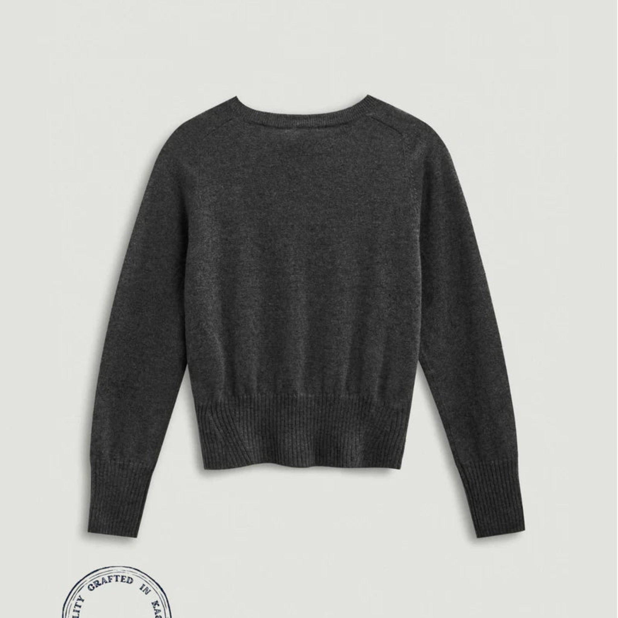 Dark gray sweater on a light gray background