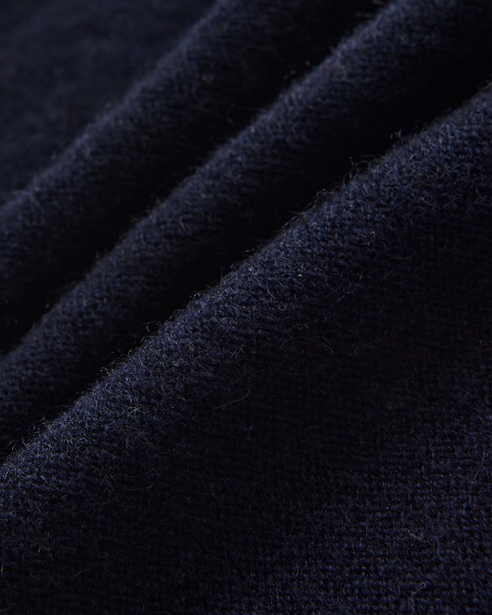 Close-up of dark blue fabric with a textured pattern