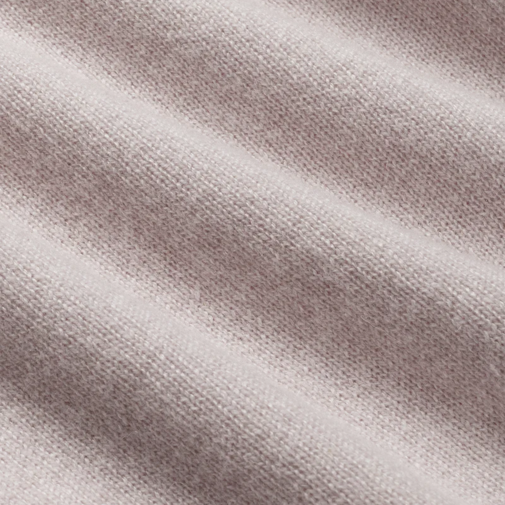 Close-up of a textured beige fabric surface