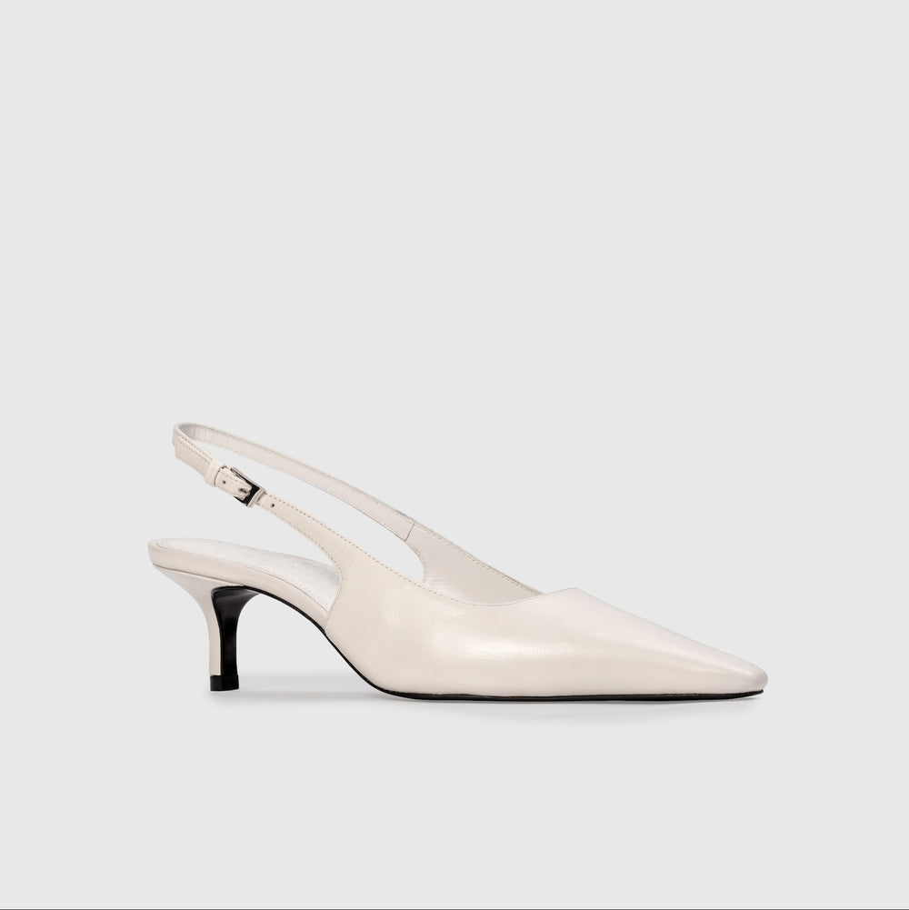 White slingback shoe on a light gray background