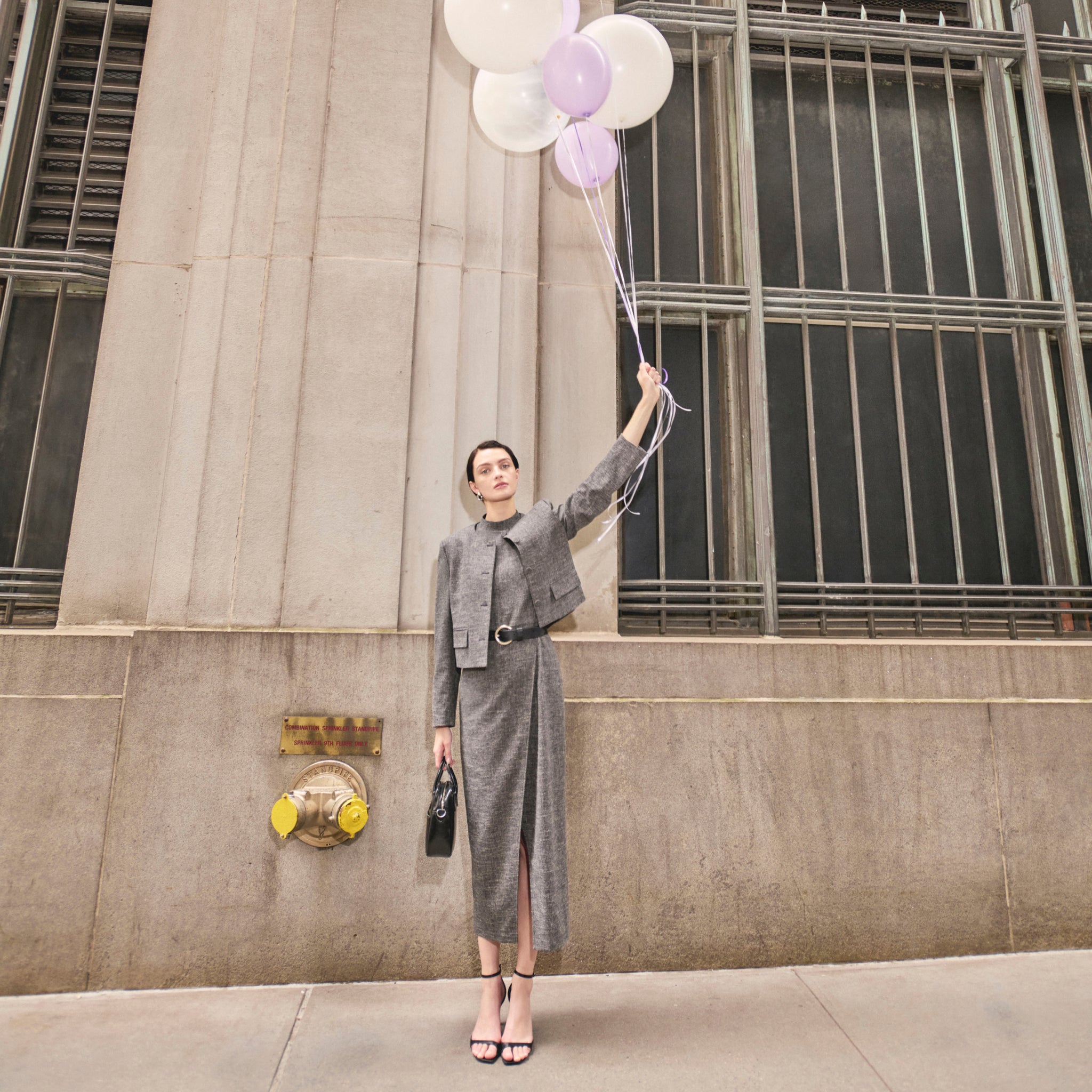 image of a woman wearing the valencia dress in black/white 