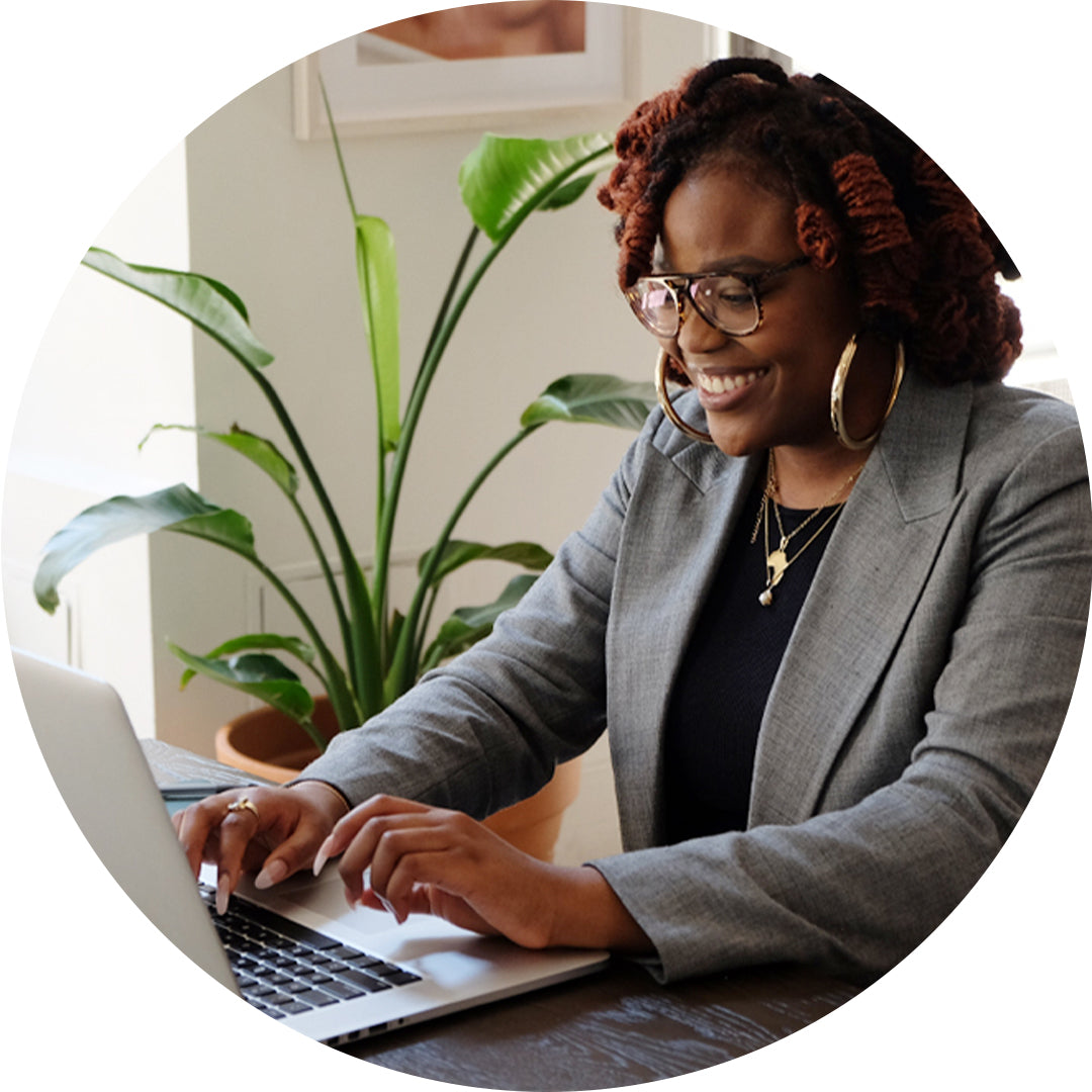 M.M.LaFleur Stylist on the computer