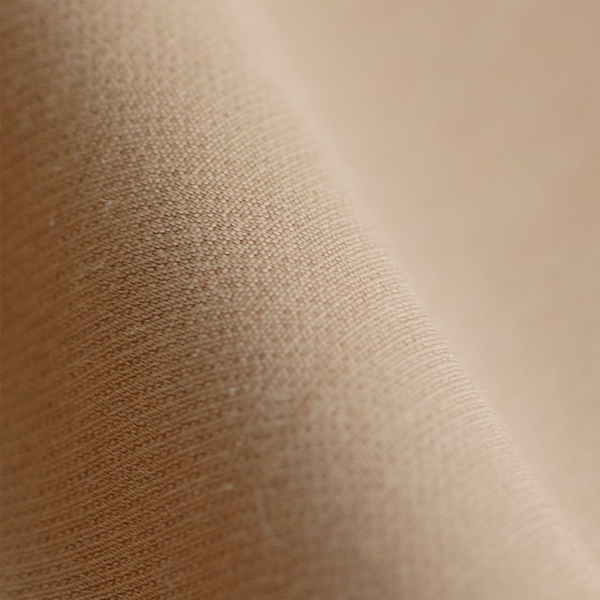 Close up image of wool twill fabric in camel