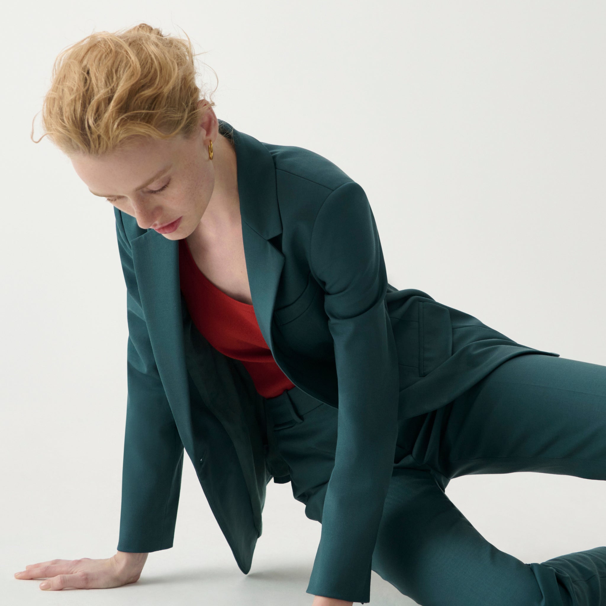 front image of a woman wearing the yasmine blazer in blue jade
