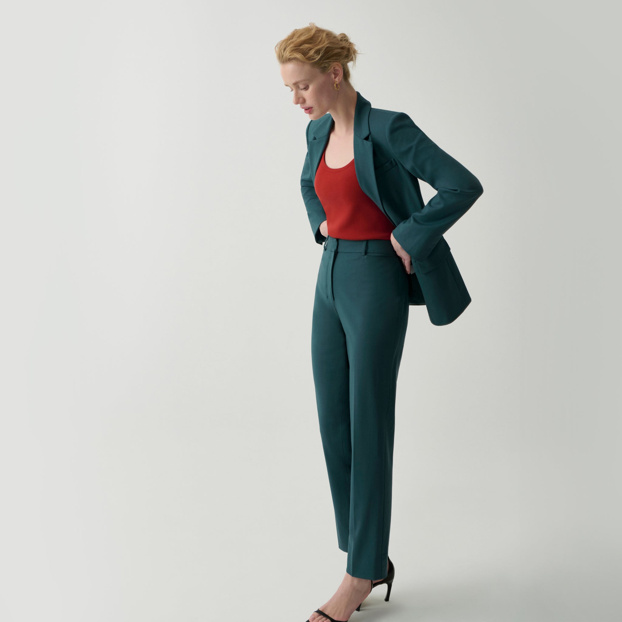front image of a woman wearing the yasmine blazer in blue jade