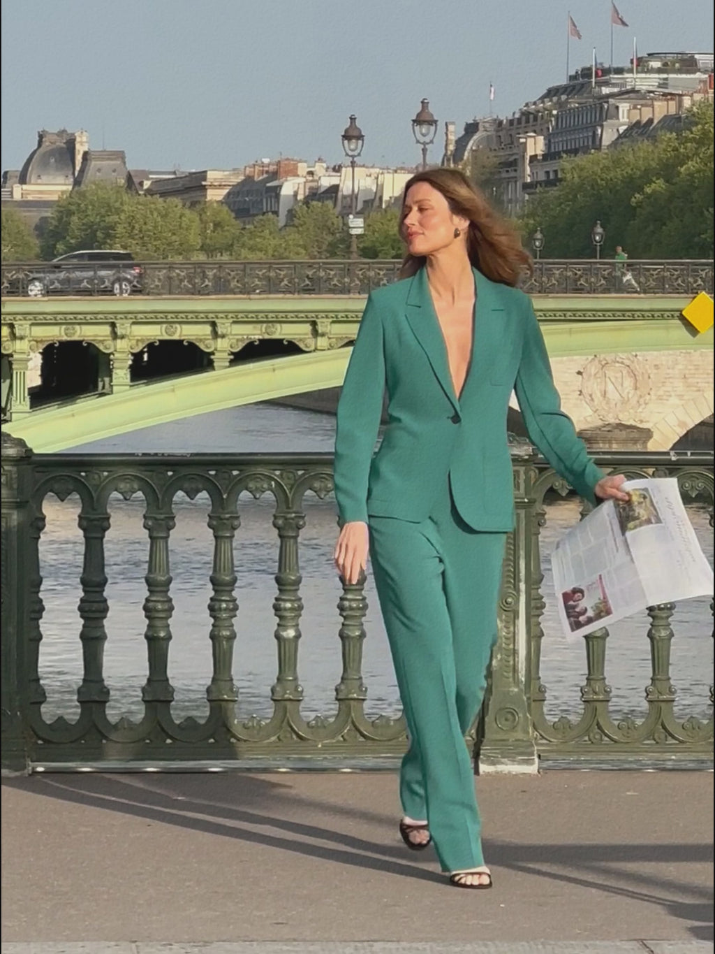 woman in teal blazer with matching pants