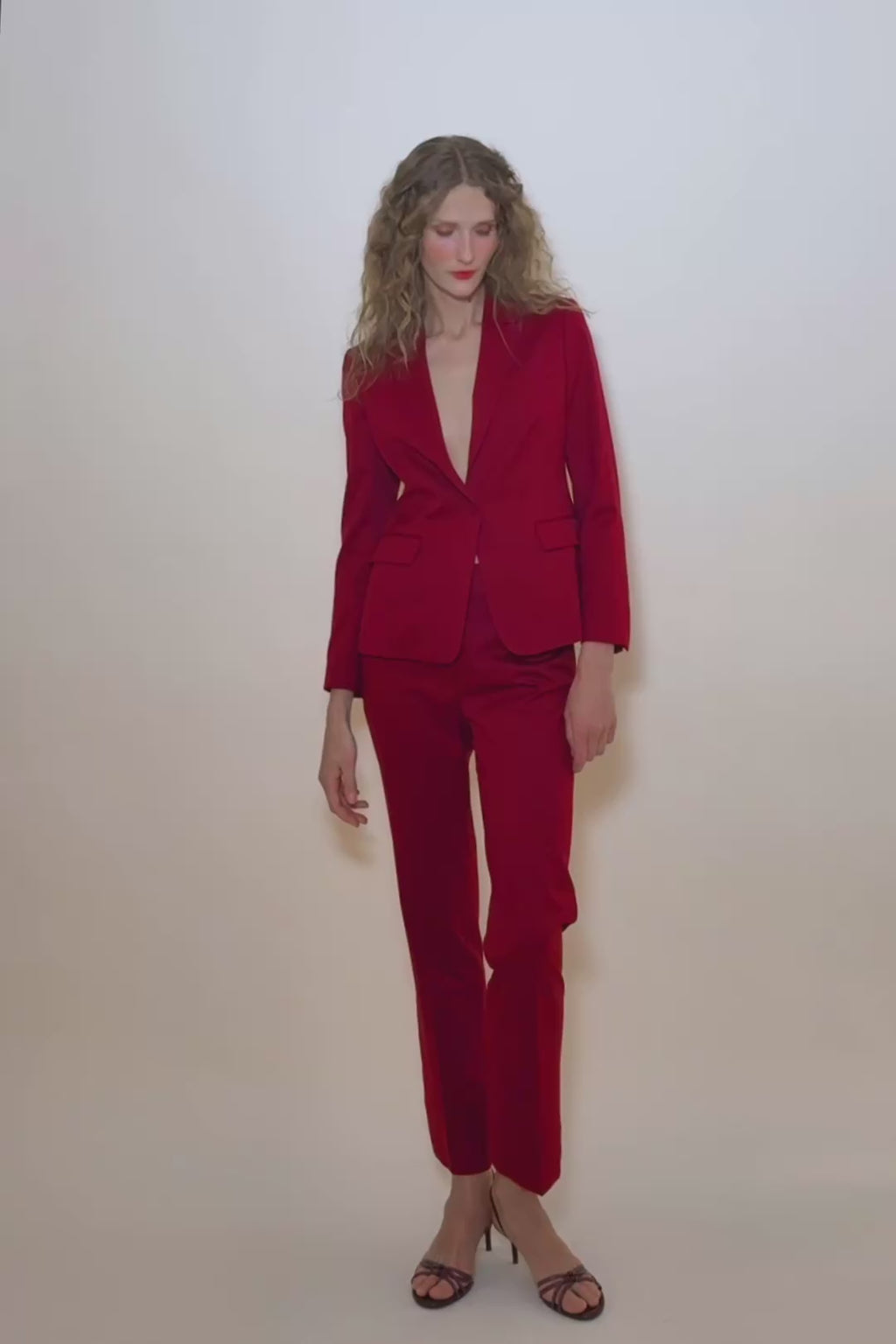 woman in red suit.
