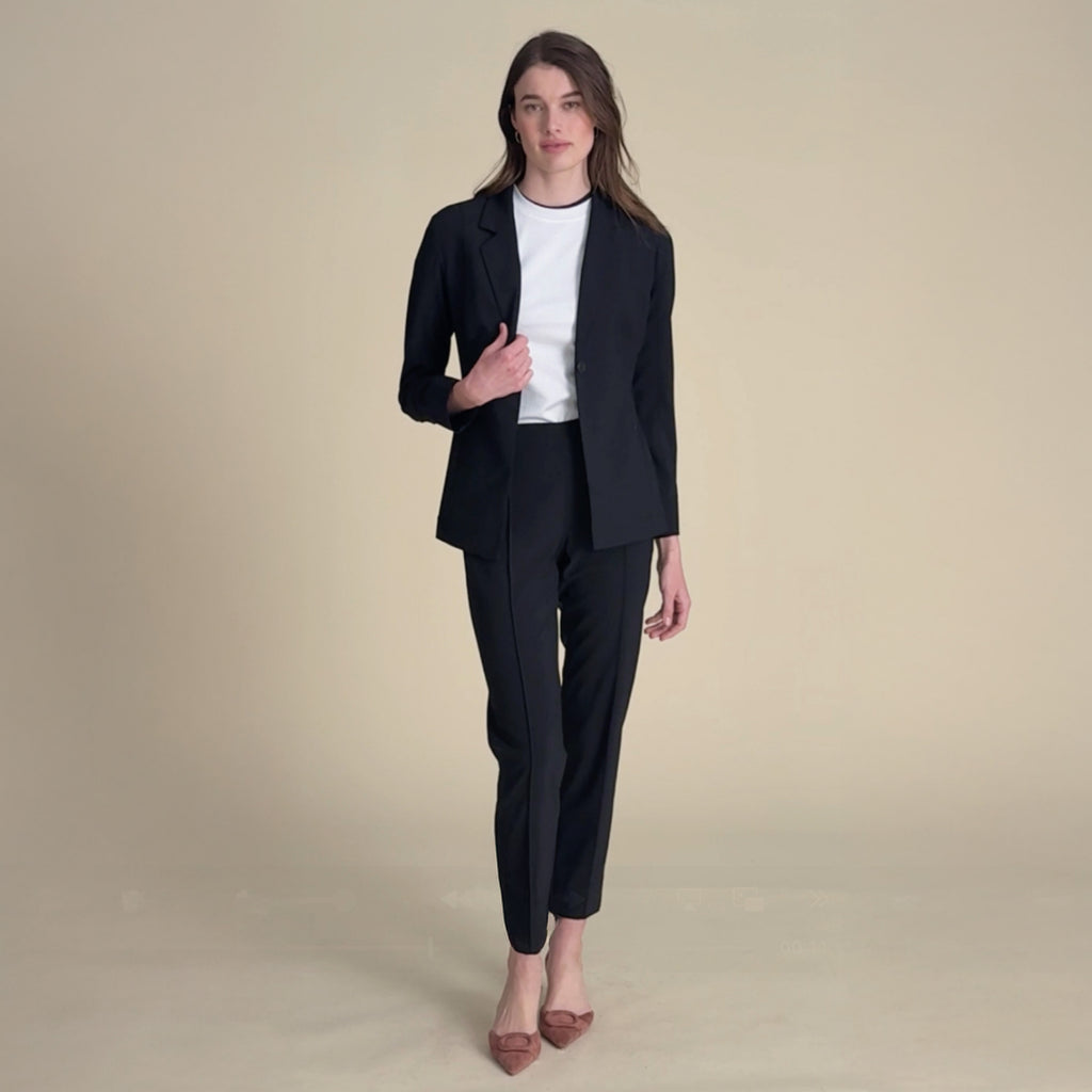 woman in black blazer and matching pants.