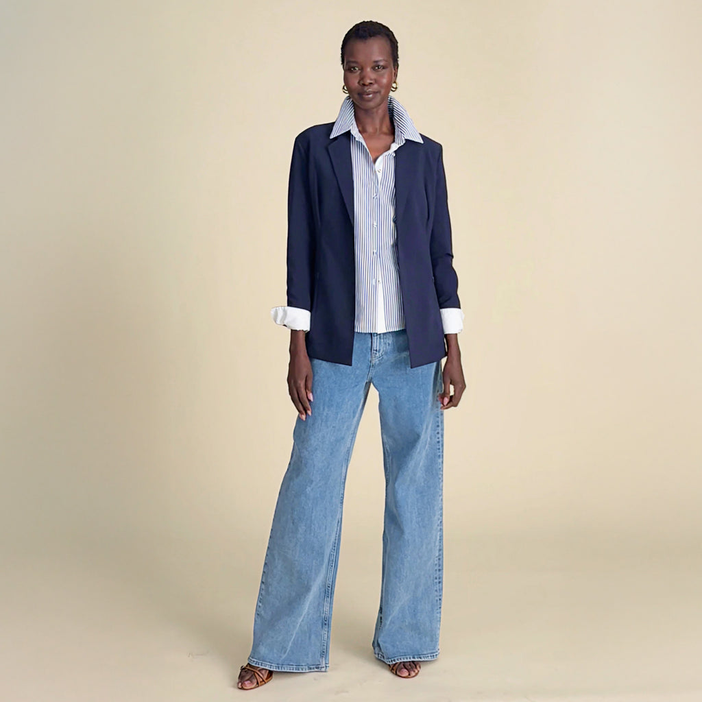 woman in blue blazer with blue Jeans