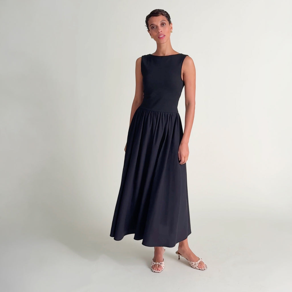 Woman wearing the Beatrice dress in Black