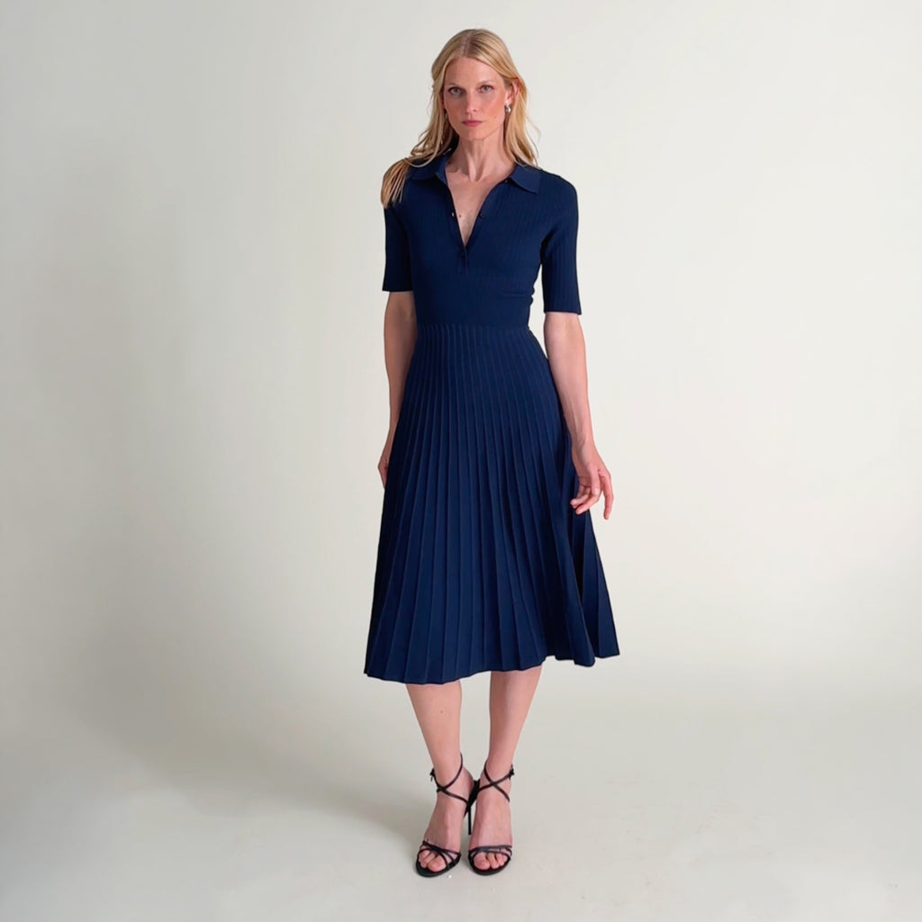 Woman wearing the lark dress in dark navy