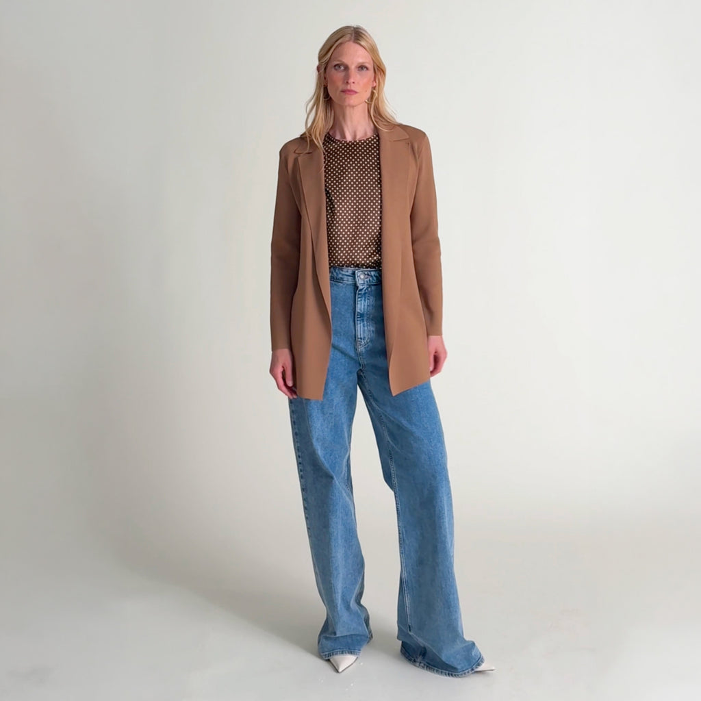 Woman wearing the Didion top in dot print and Merritt jardigan in saddle