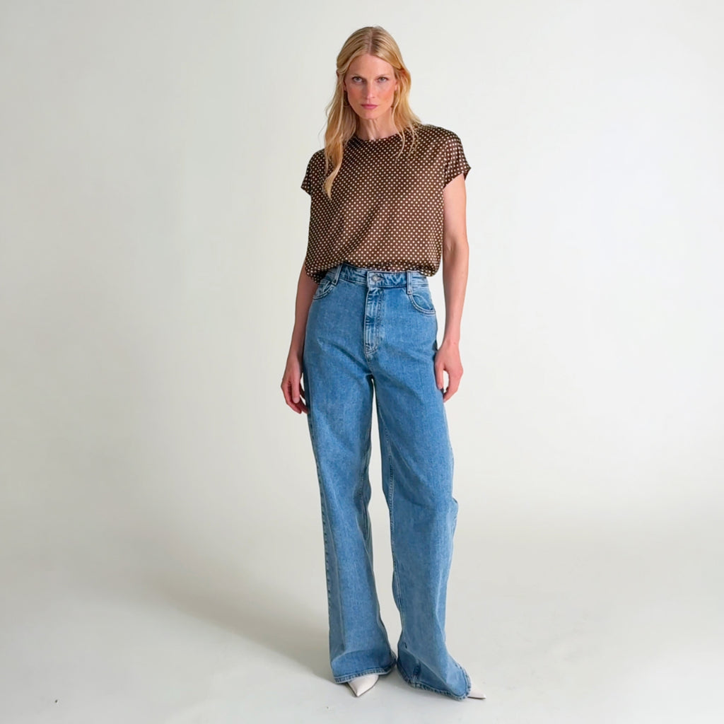 Woman wearing the Didion top in dot print