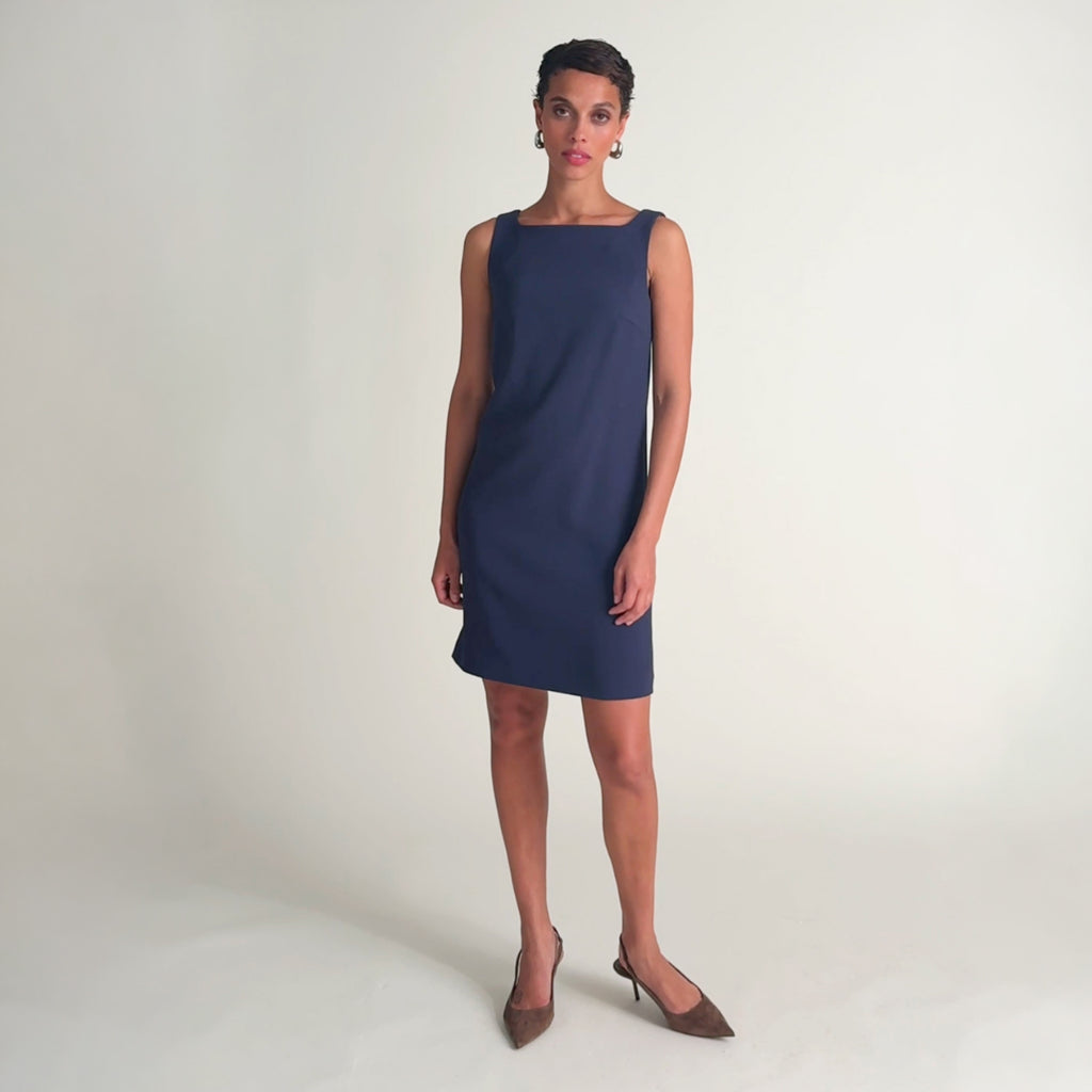 Woman wearing the madge dress in oxford
