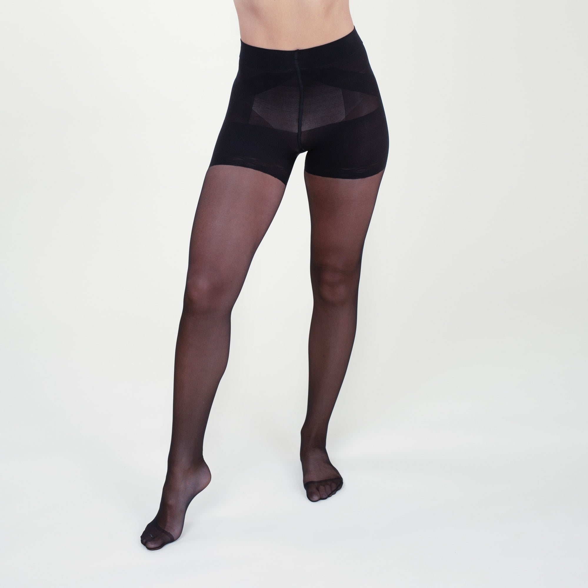 Front image of a woman standing wearing the Threads Sheer Tights in Black