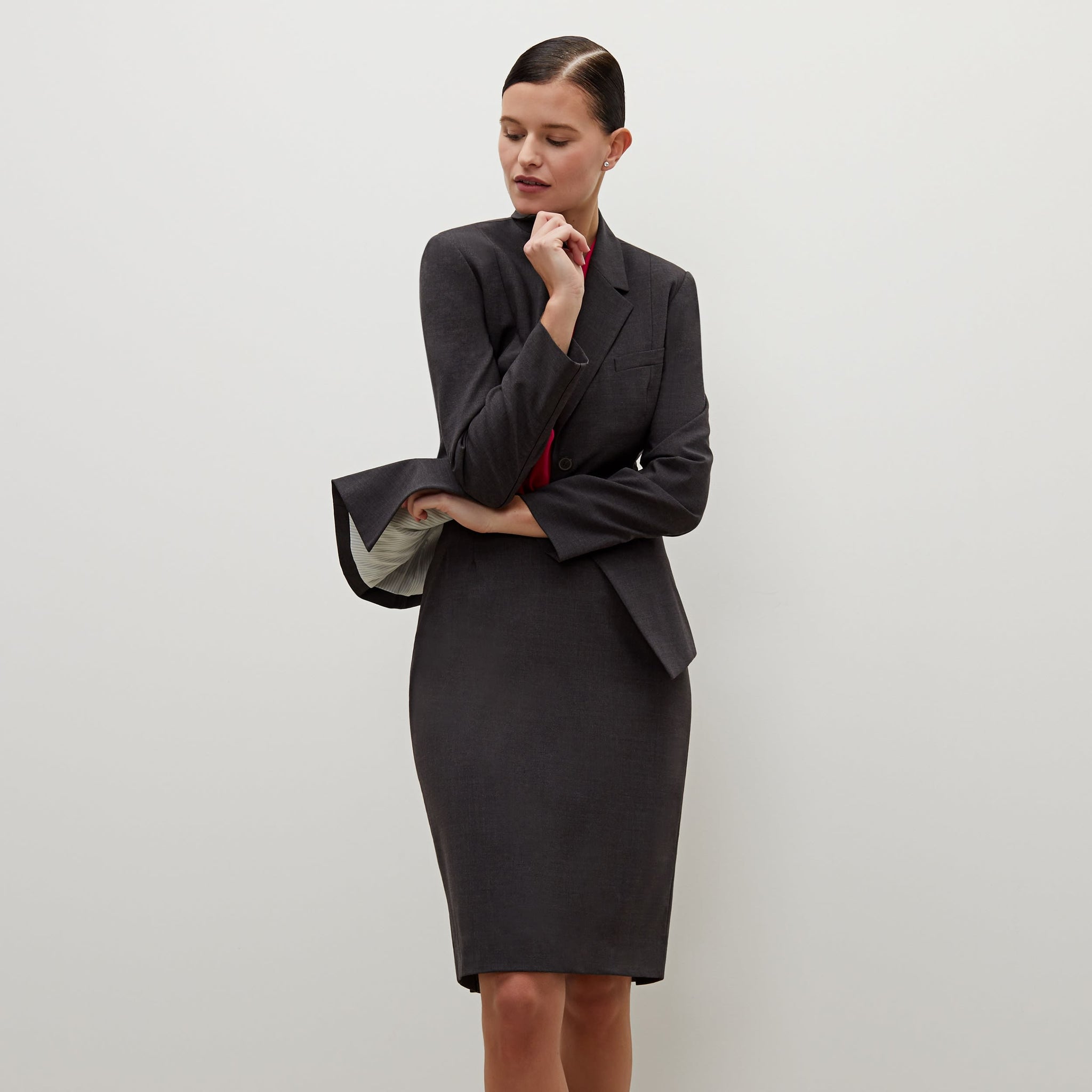 Front image of a woman standing wearing the Cobble Hill Skirt in Gray Melange 