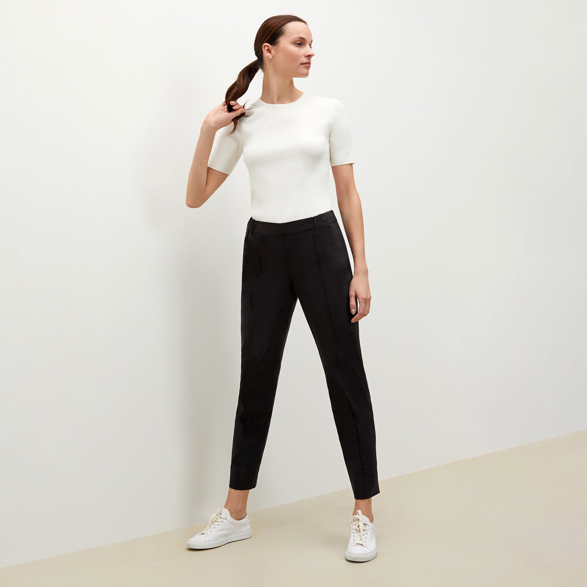 Side image of a woman standing wearing the Colby Jogger in Black