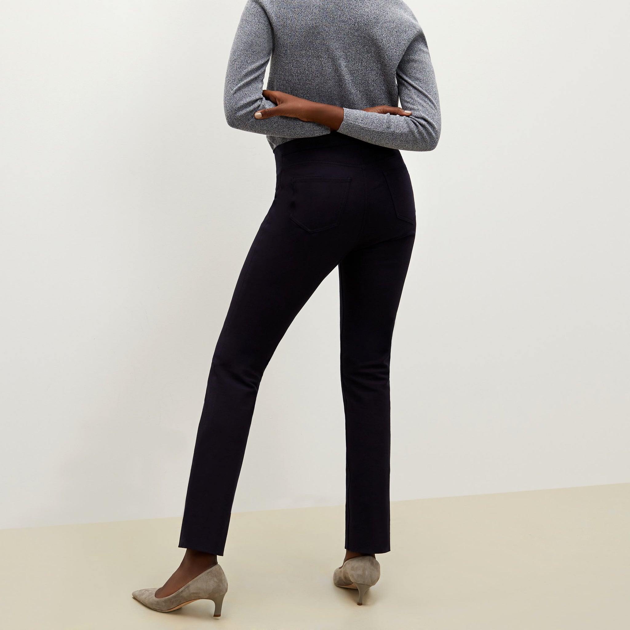 Back image of a woman standing wearing the Hockley pant in ink