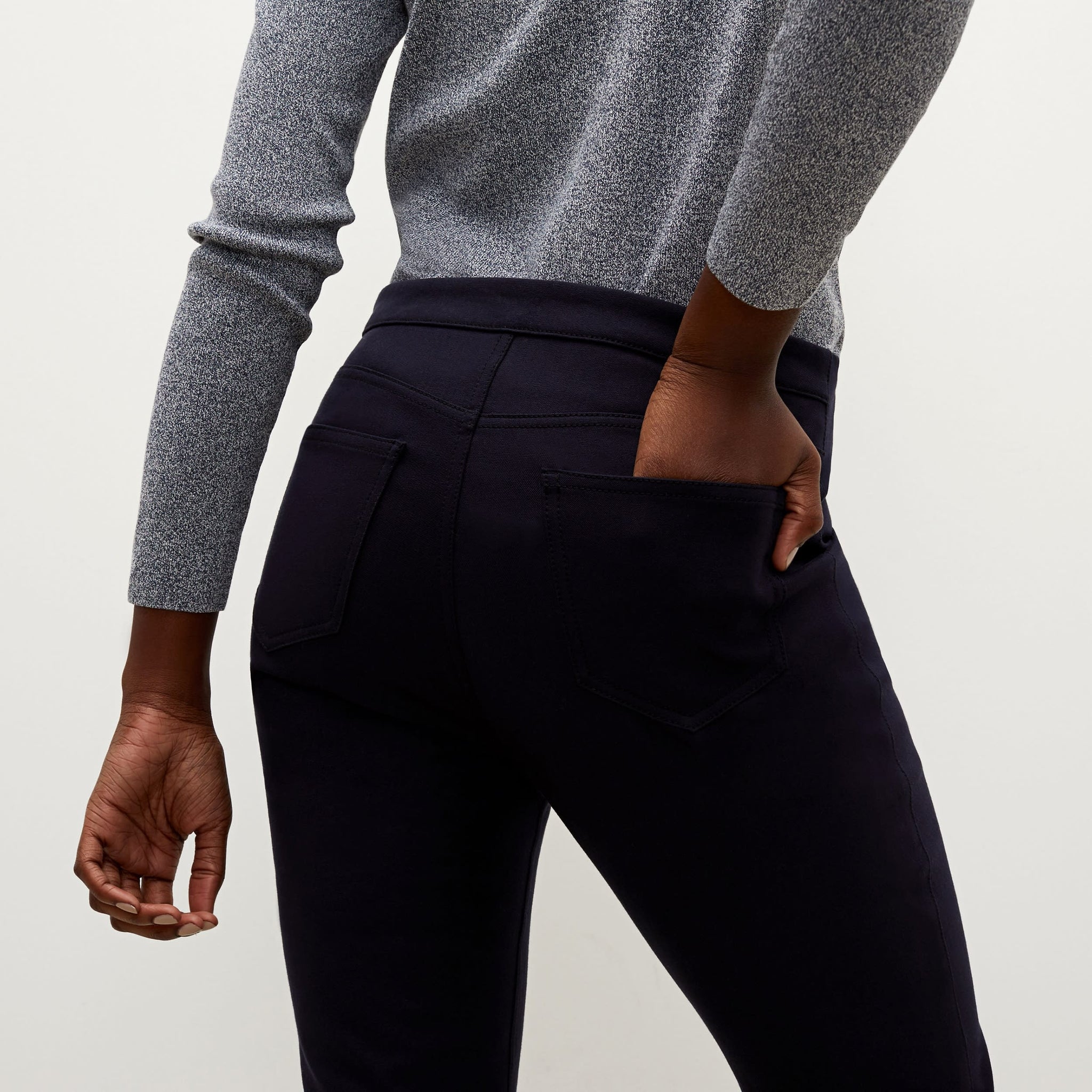 Detail image of a woman standing wearing the Hockley pant in ink