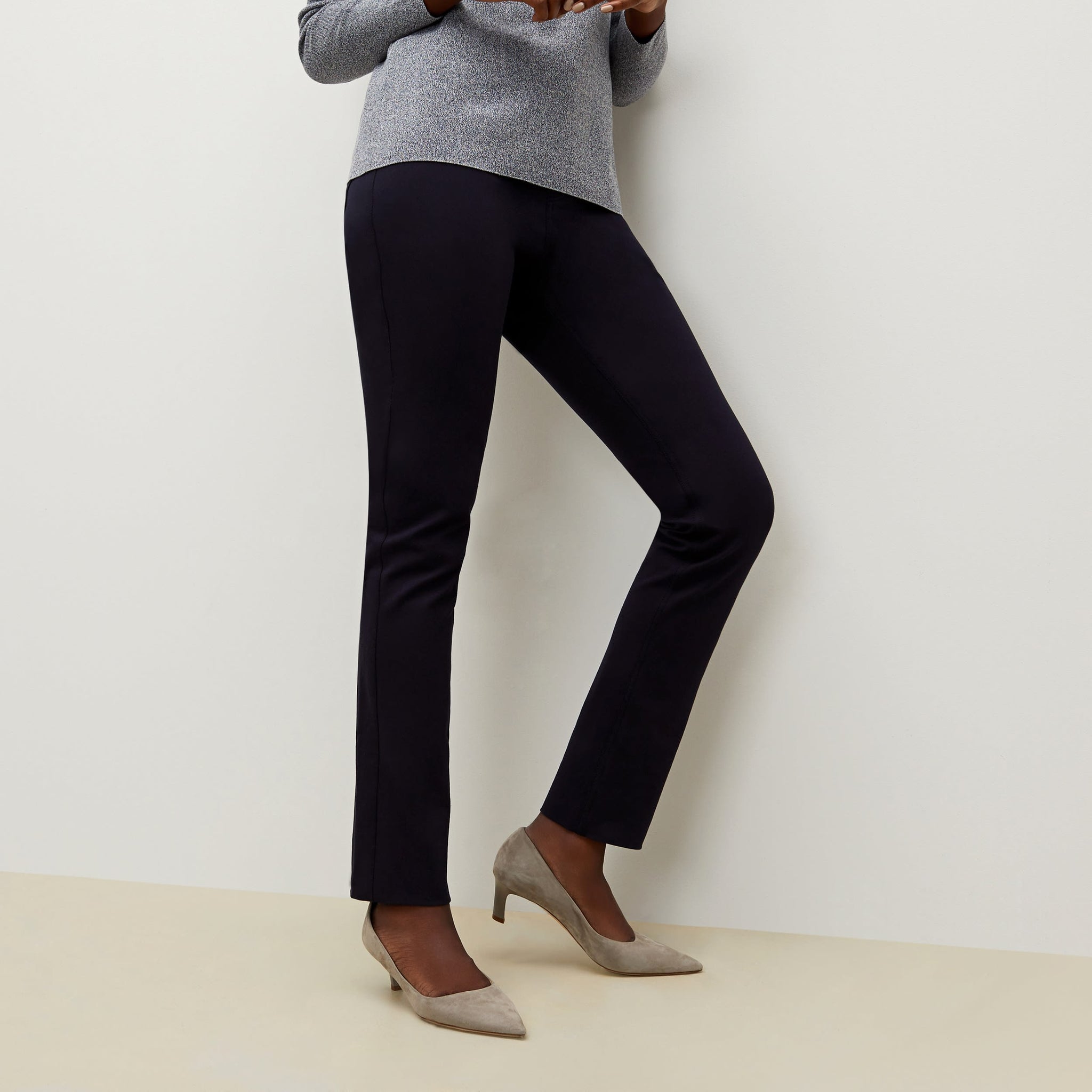 Side image of a woman standing wearing the Hockley pant in ink