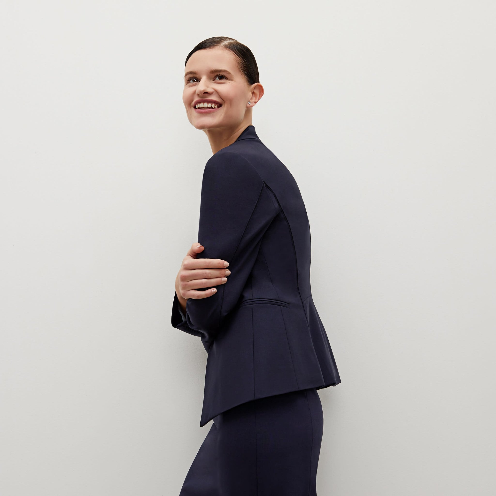 Side image of a woman standing wearing the Hoffman blazer in Galaxy Blue