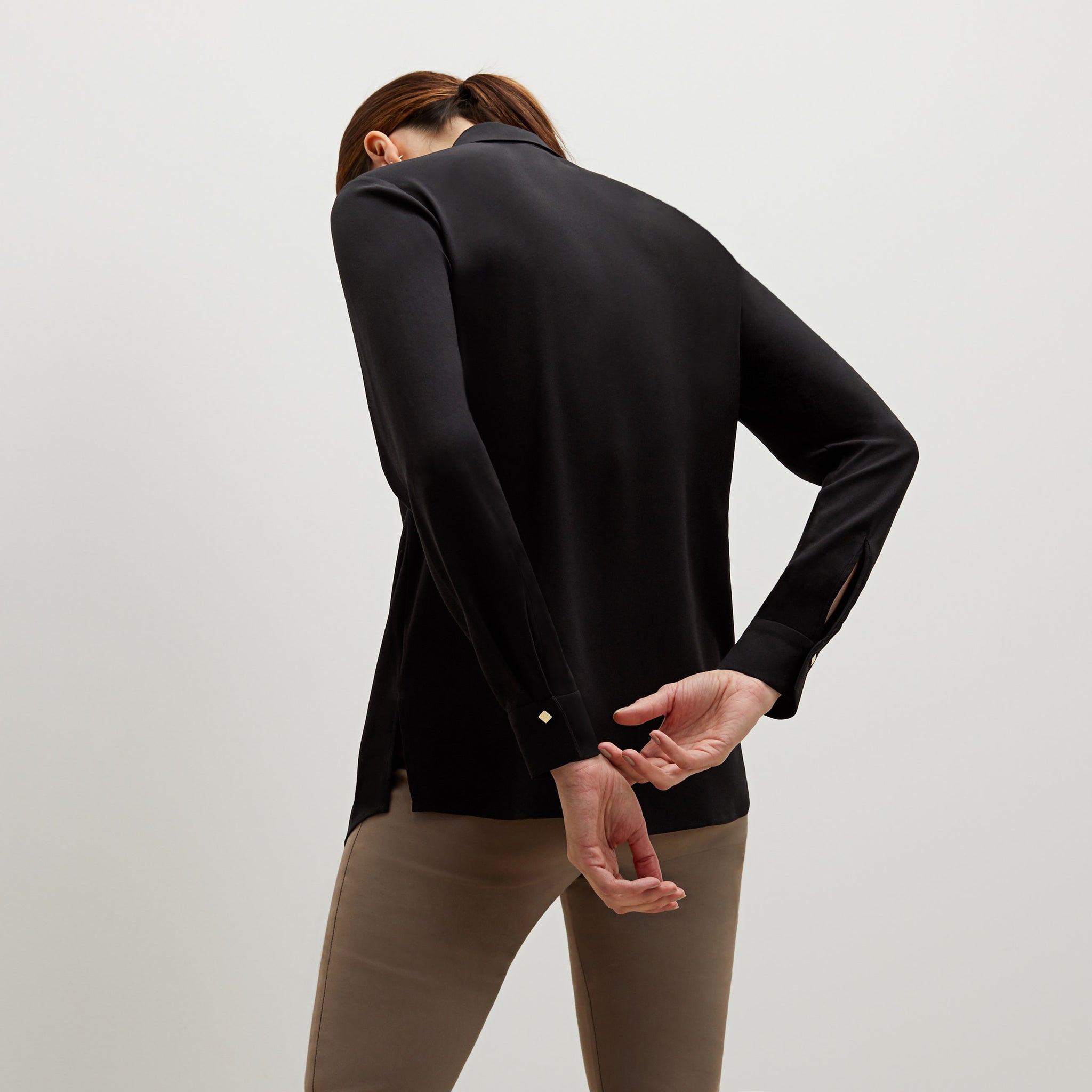 Back image of a woman standing wearing the Lagarde shirt in black