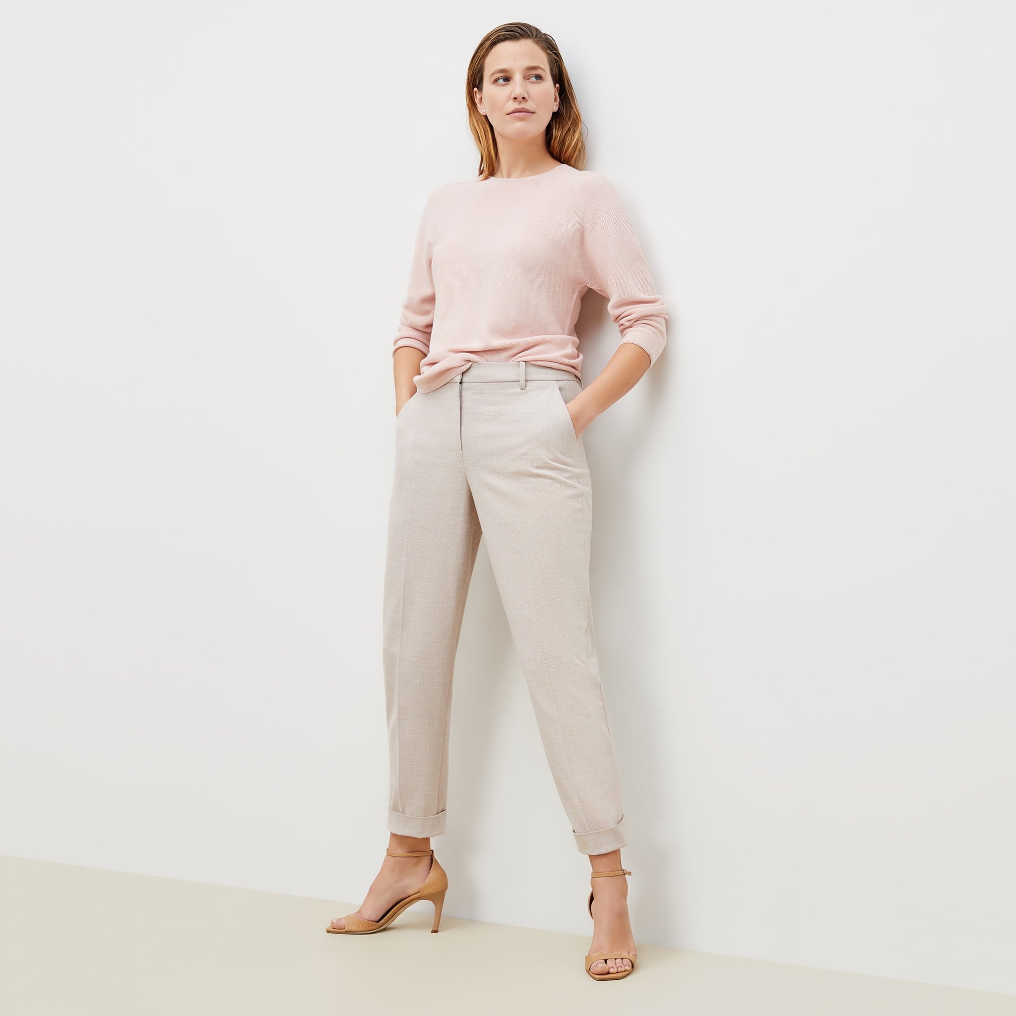 Front image of a woman standing wearing the chadwick top in peony