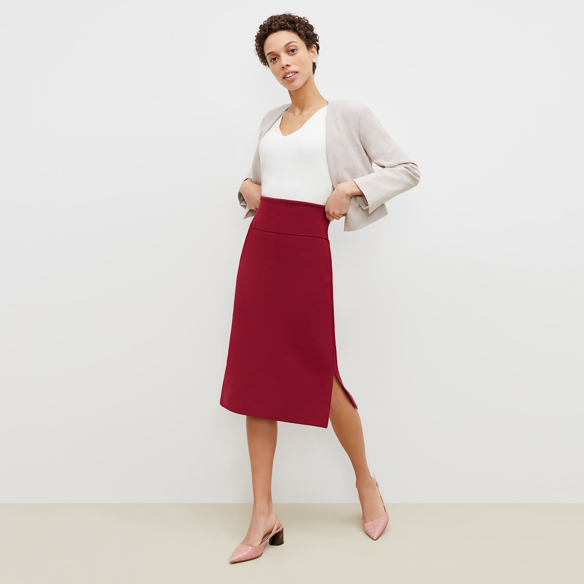 Front image of a woman standing wearing the harlem skirt in hibiscus