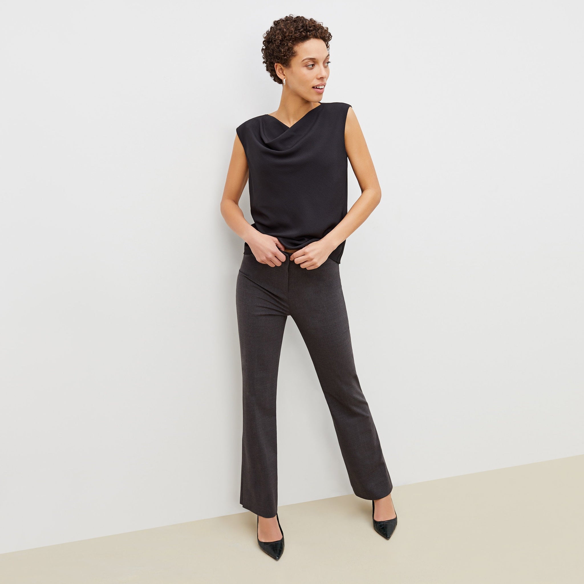 Front image of a woman standing wearing the clooney pant in charcoal melange