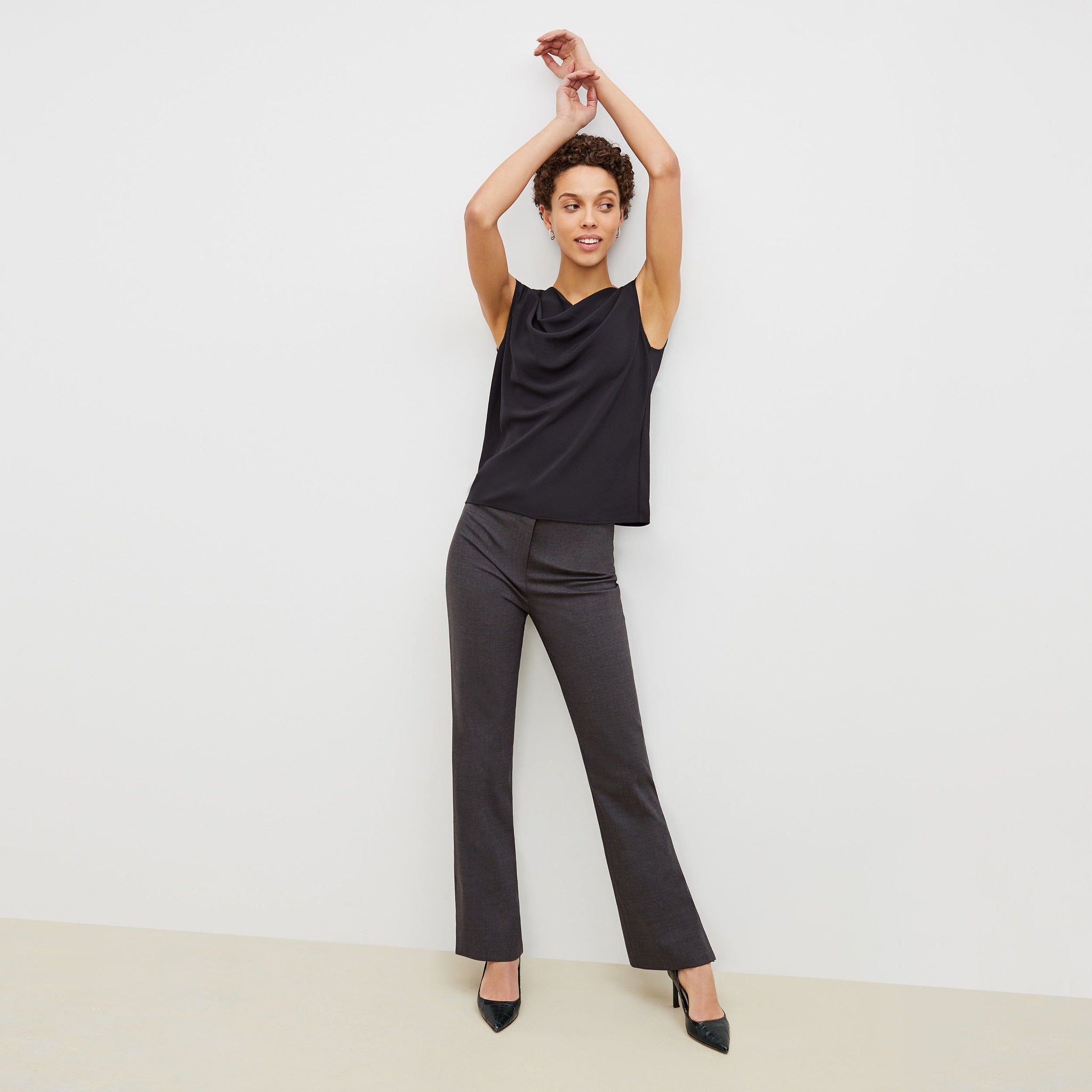 Front image of a woman standing wearing the clooney pant in charcoal melange 