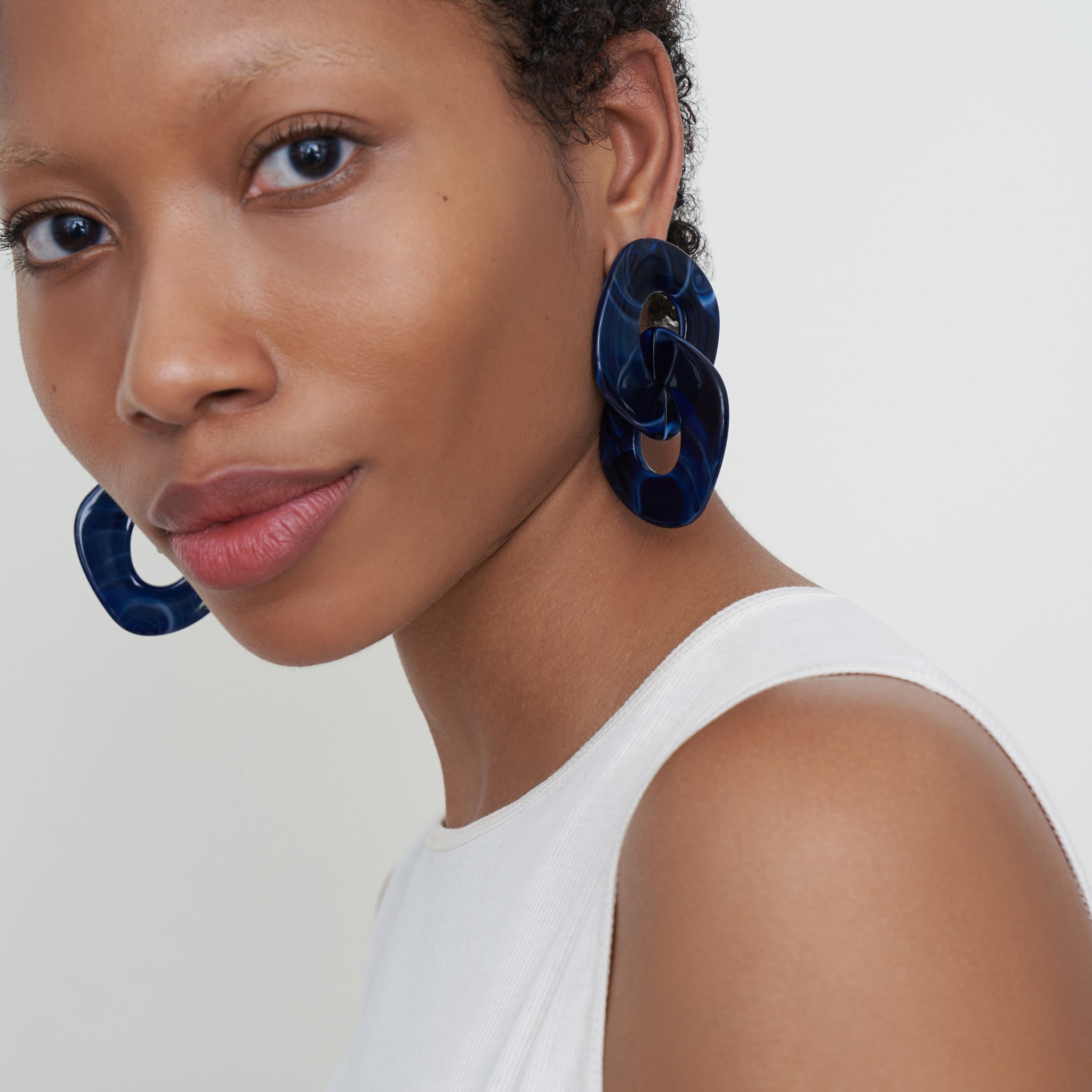 Woman wearing Briar Earrings in Indigo Blue