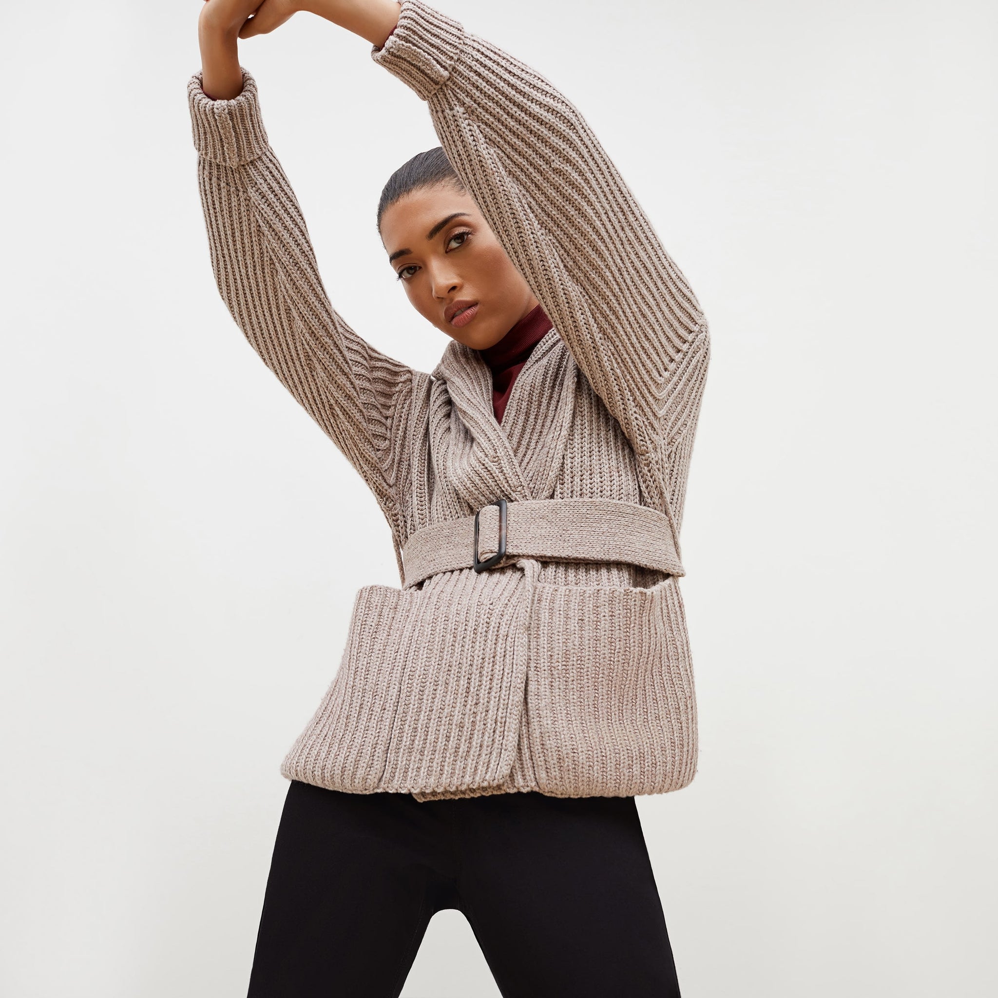 Front image of a woman standing wearing the Snyder Jacket—Lush Merino in Barley 