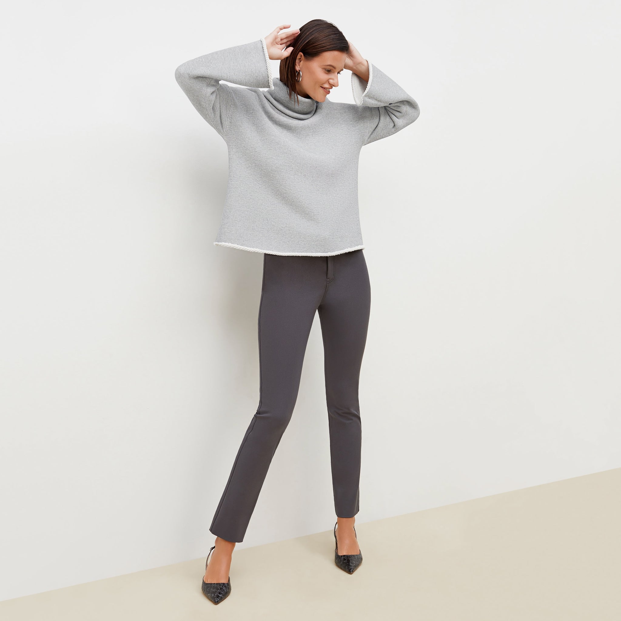 Front image of a woman standing wearing the Sharon Top—Plush Terry in Gray / Ivory