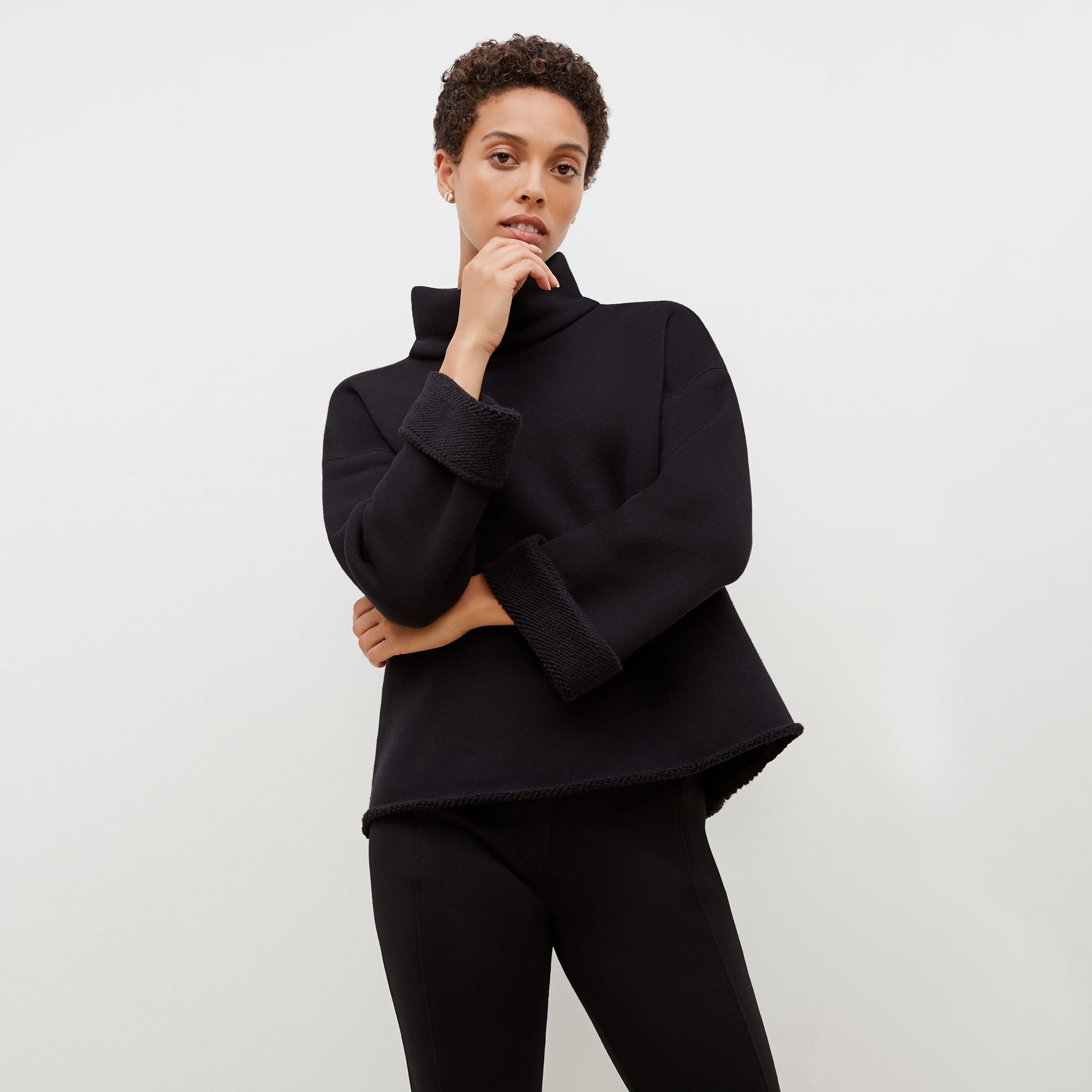 Front image of a woman standing wearing the Sharon Top—Plush Terry in Black