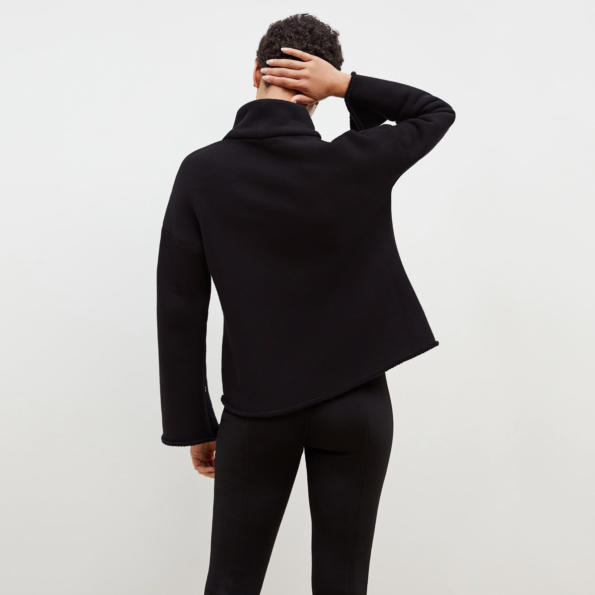 Back image of a woman standing wearing the Sharon Top—Plush Terry in Black