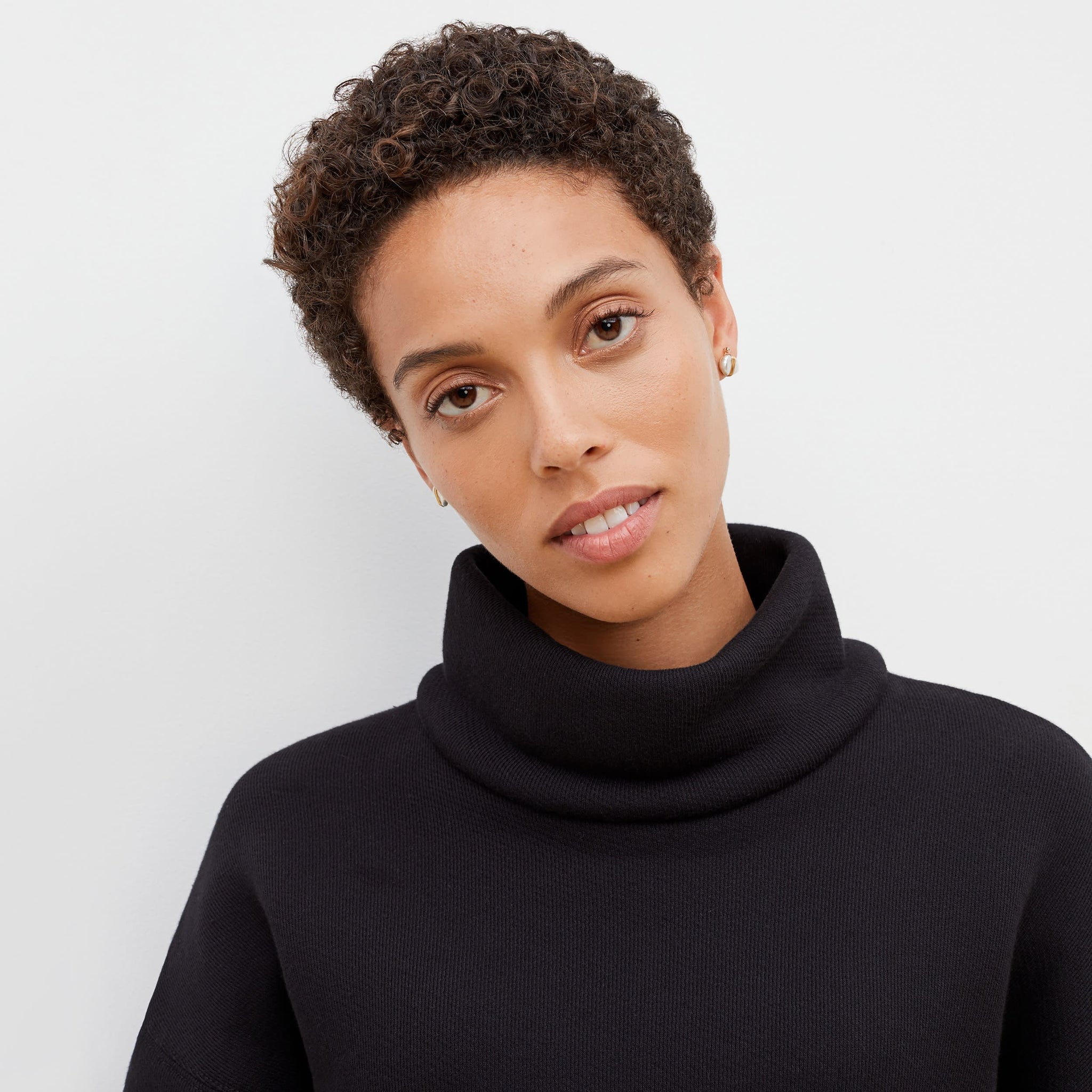 Detail image of a woman standing wearing the Sharon Top—Plush Terry in Black