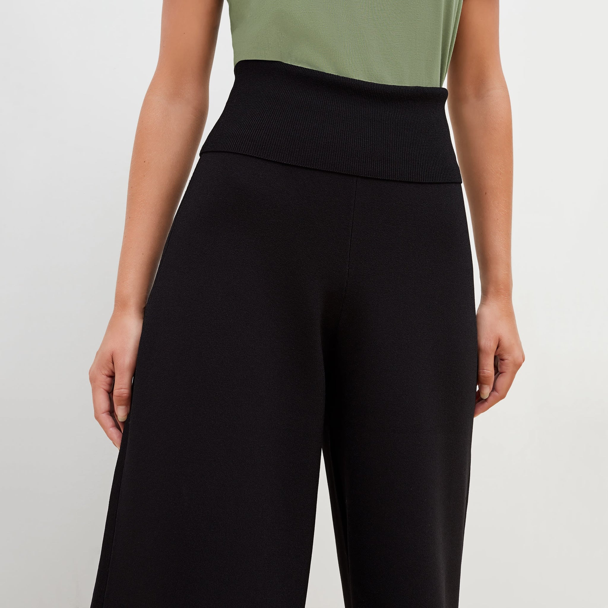 Detail image of a woman standing wearing the Rogala Pant—Jardigan Knit in Black