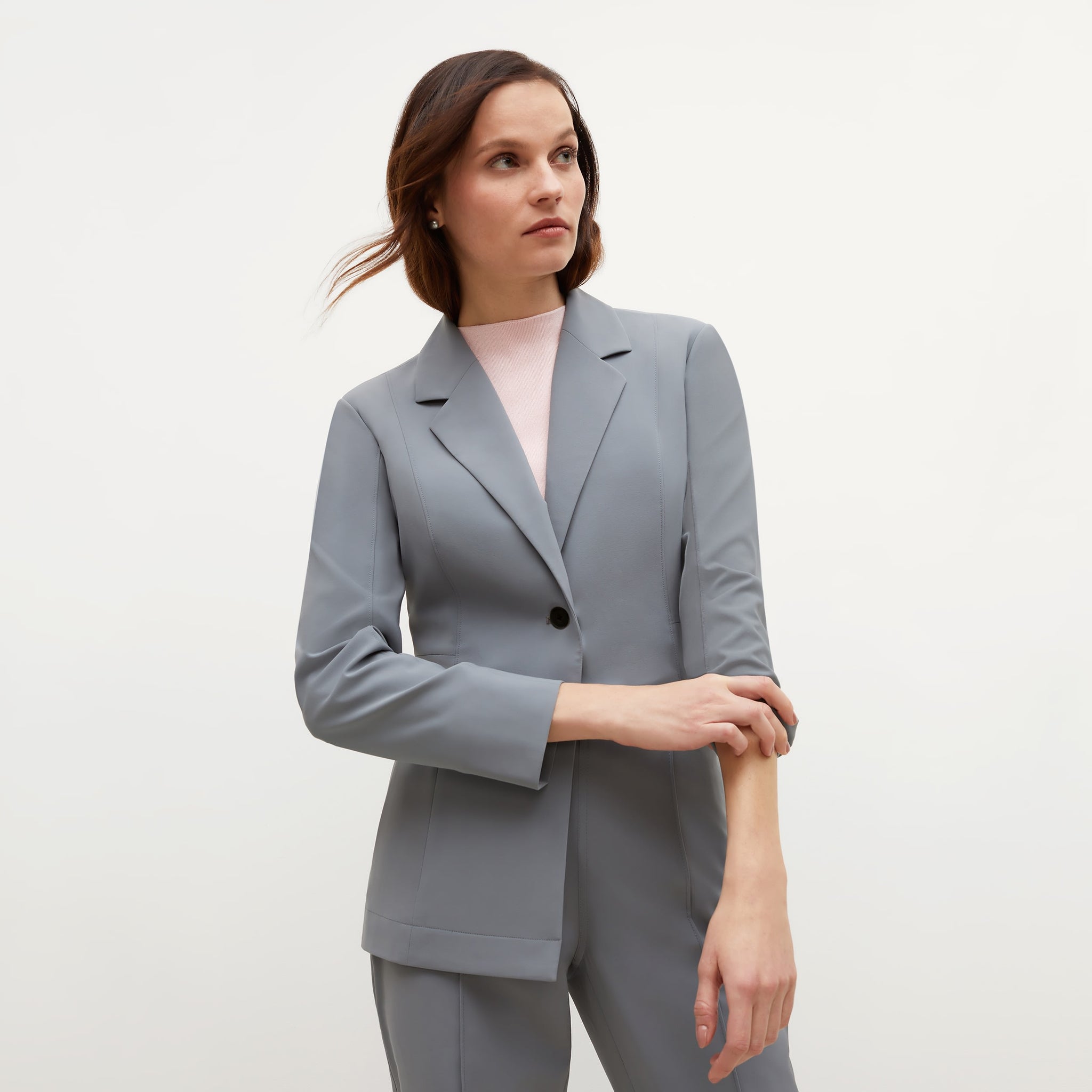 Front image of a woman standing wearing the Giulia Top—365Knit in Rosewater