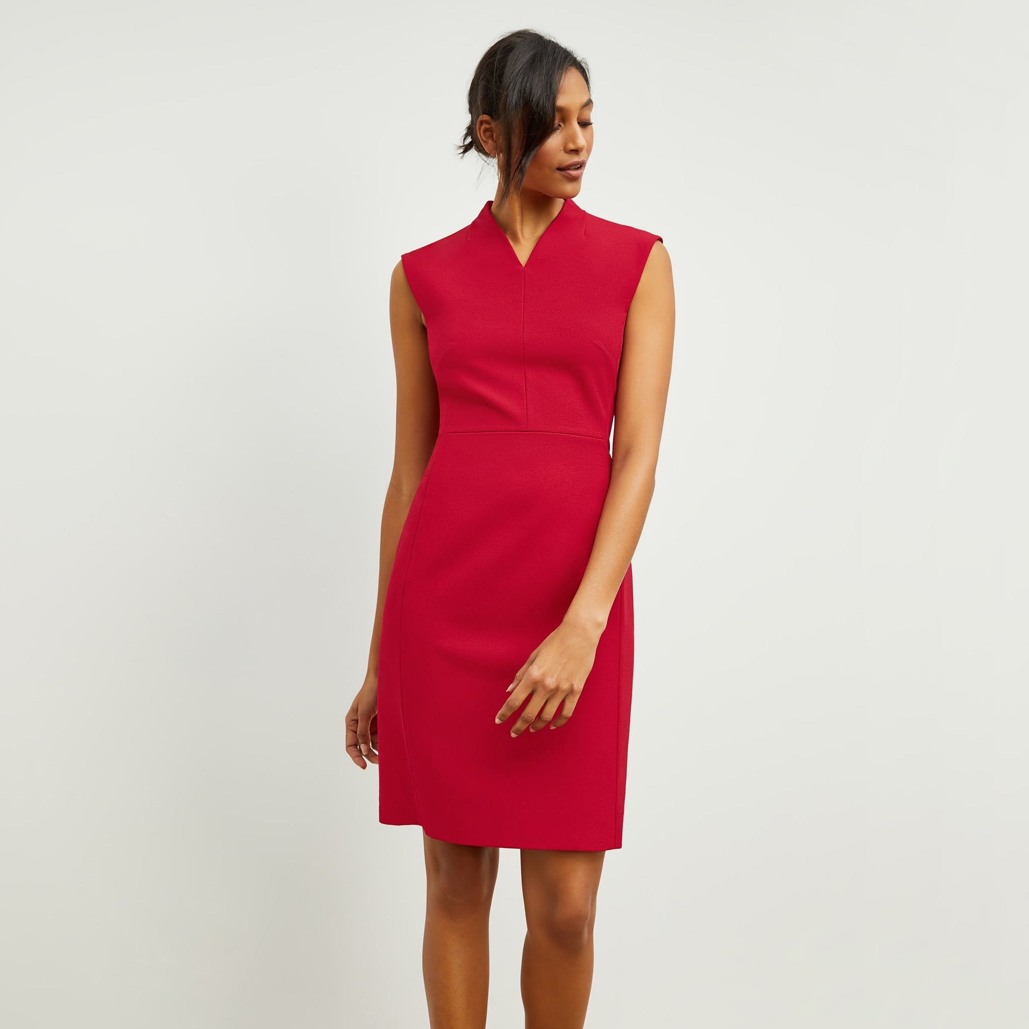 Front image of a woman standing wearing the Aditi Dress—Recycled WonderTex in Rhubarb