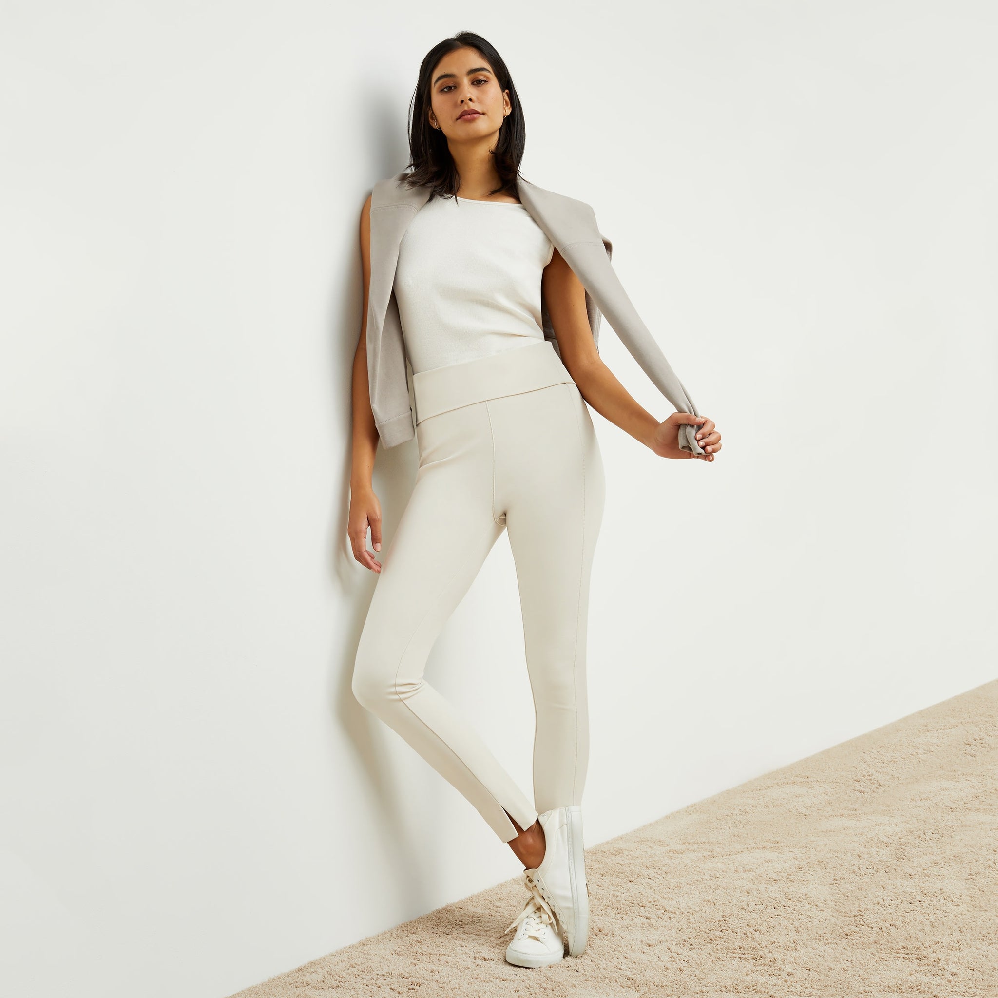 Front image of a woman standing wearing the stella legging in pearl 