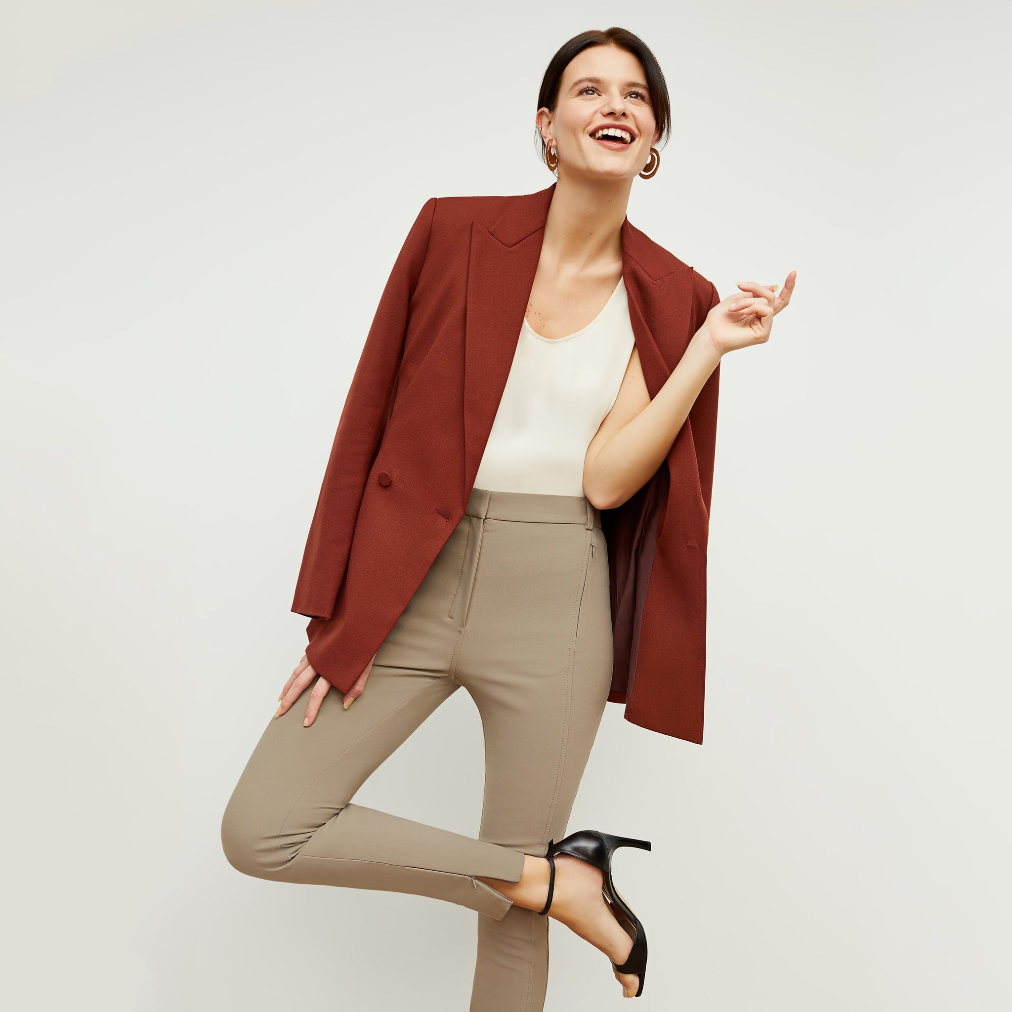 Front image of a woman standing wearing the curie pant in russet