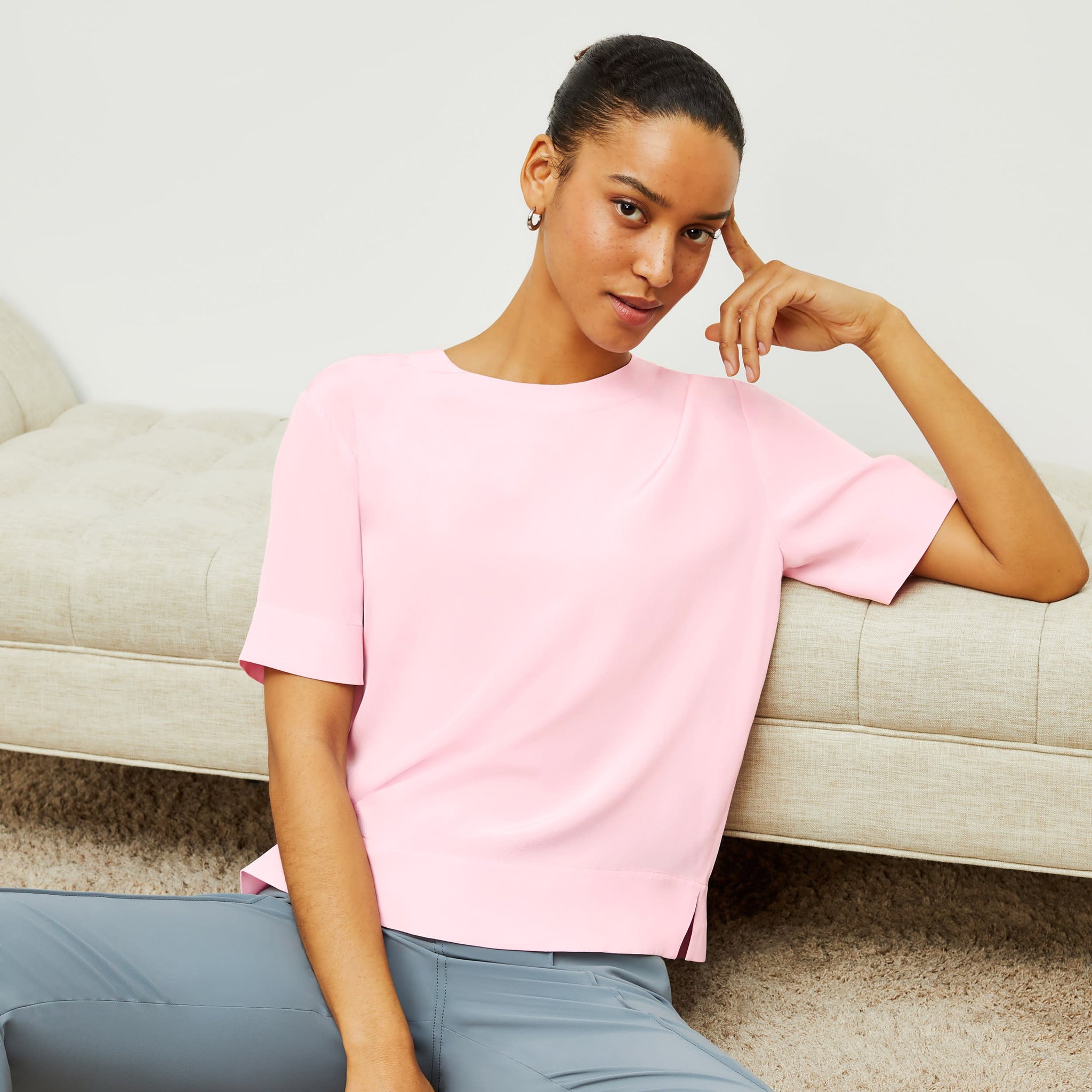 Front image of a woman standing wearing the Annika Tee—Washable Silk in Rosewater