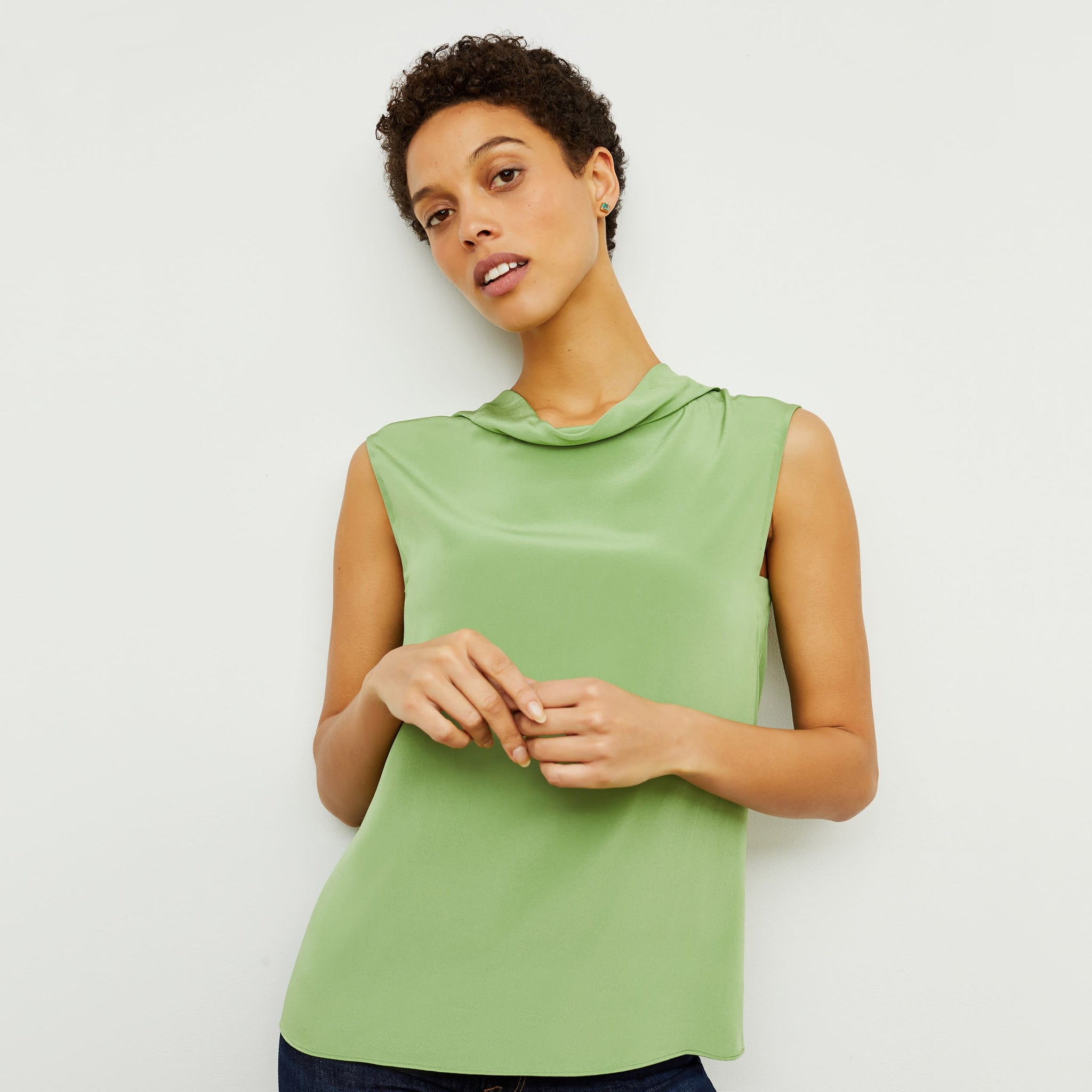 Front image of a woman standing wearing the Daisy Top—Washable Silk in Cactus 