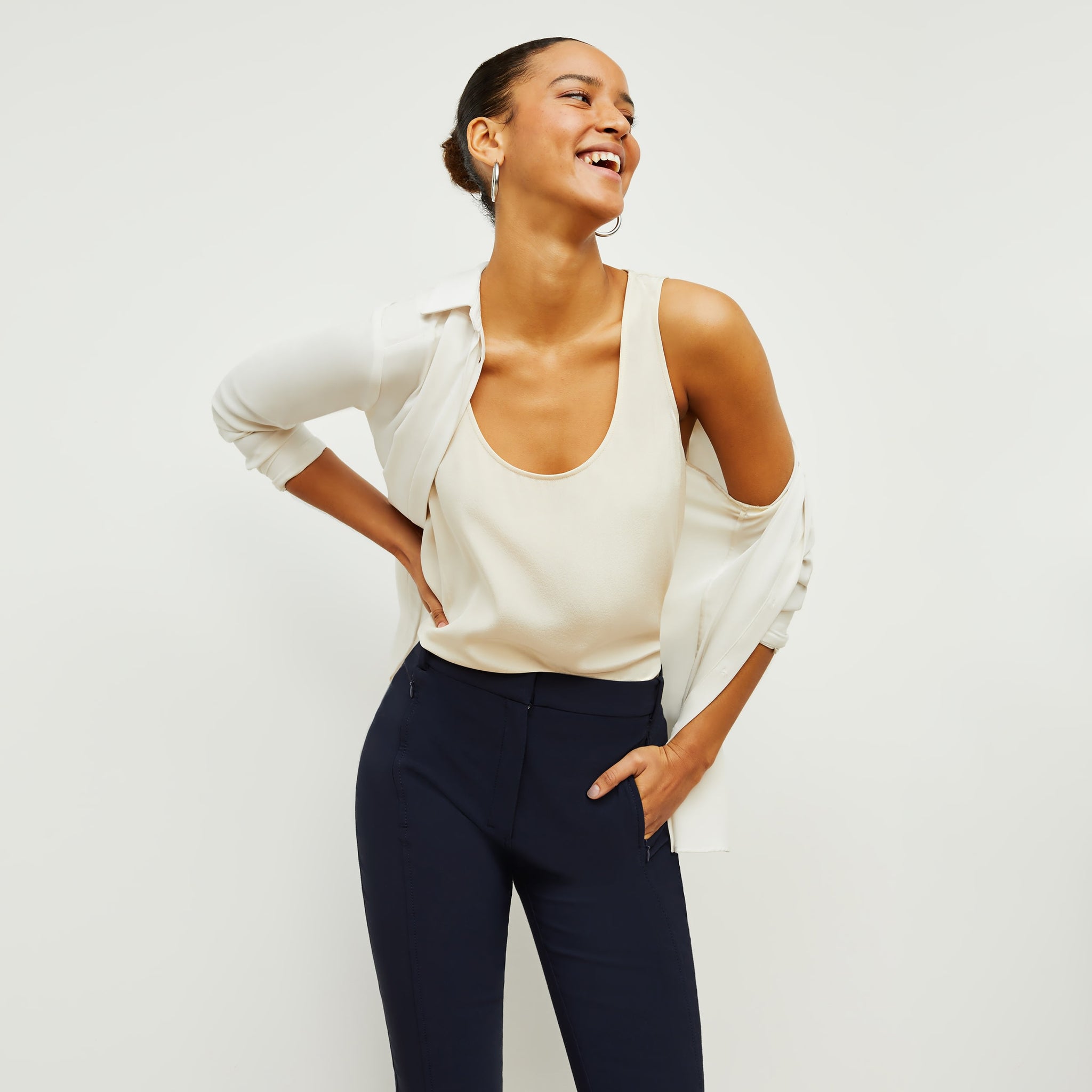 Front image of a woman standing wearing the Vicky Tank—Washable Silk in Pearl