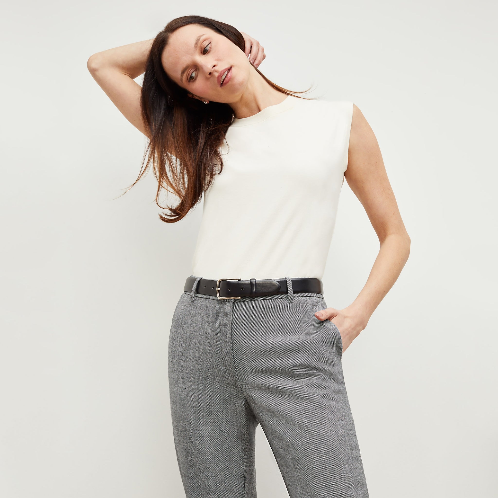 Front image of a woman standing wearing the alina top in compact cotton in ivory