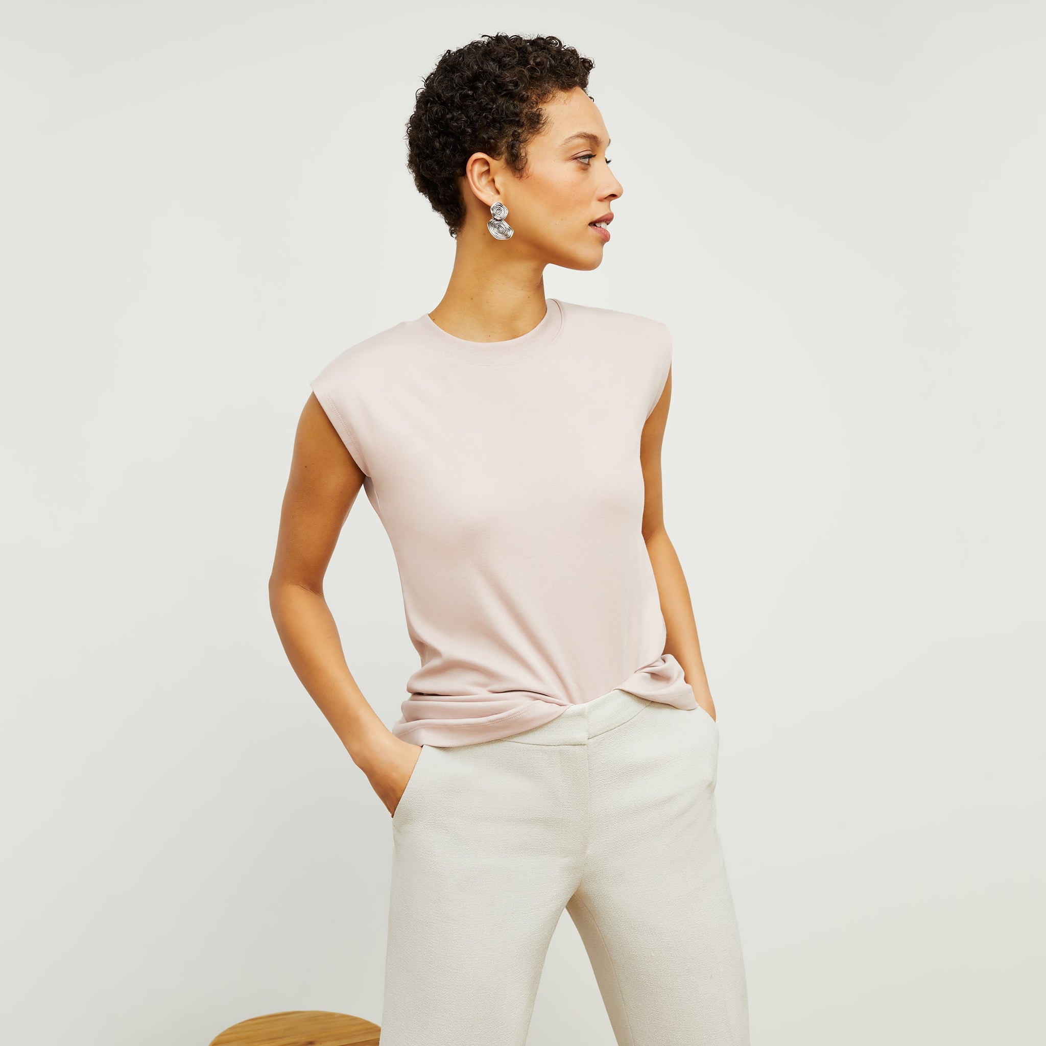 Front image of a woman standing wearing the Alina T-Shirt—Compact Cotton in Dusty Pink 
