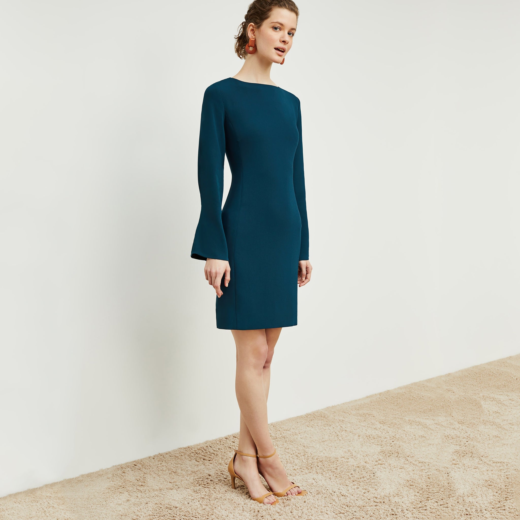 Side image of a woman standing wearing the Regina Dress in Rainforest
