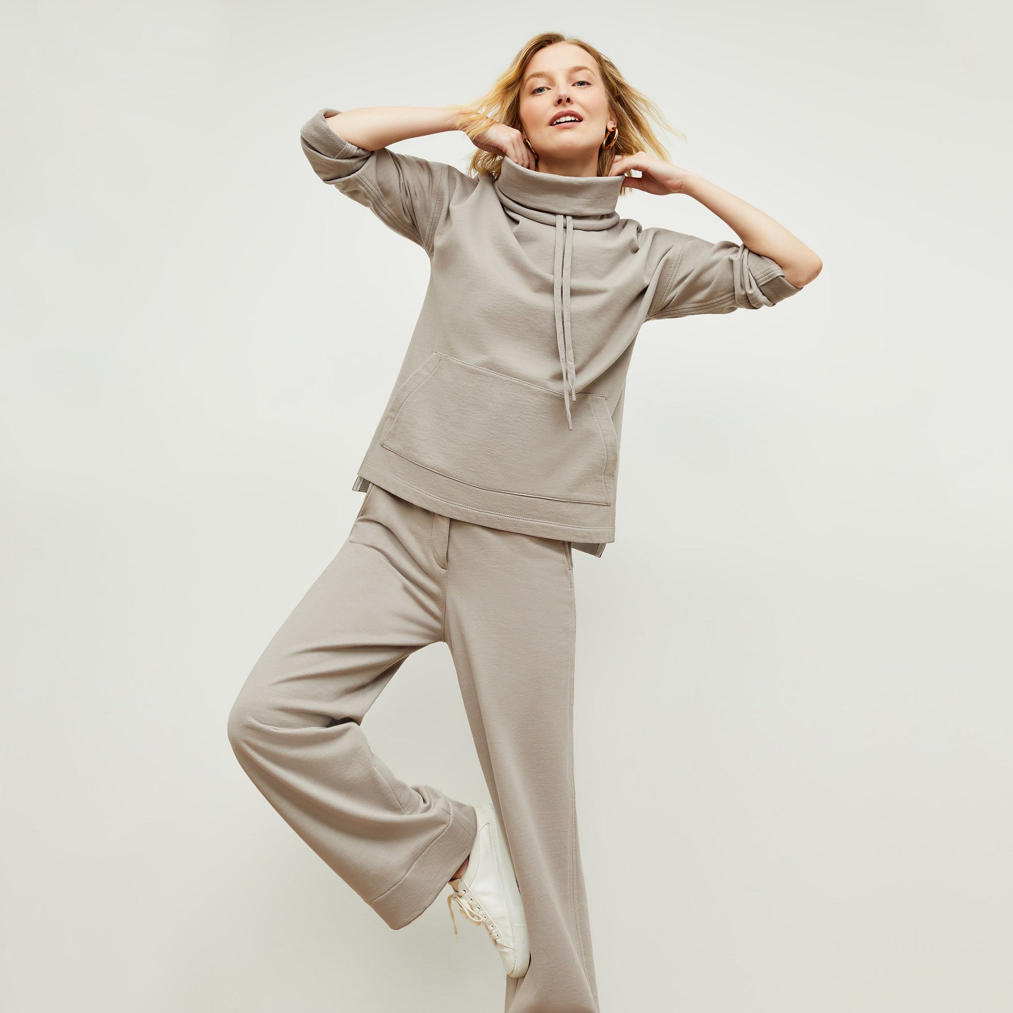 Front image of a woman standing wearing the Georgina Lounger—Fine Terry in Smoky Taupe