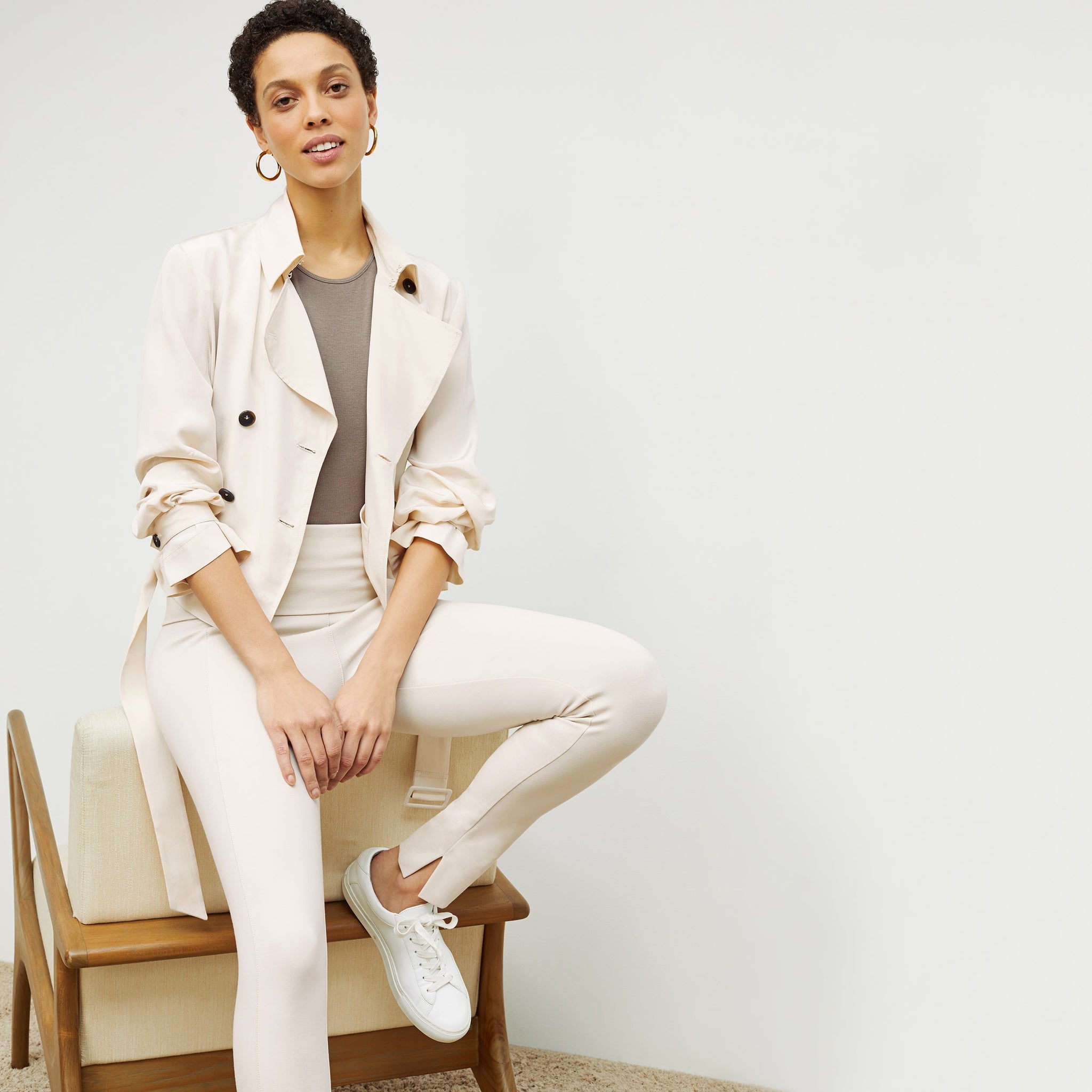 Front image of a woman standing wearing the Scotte Jacket—SustainSilk in Pearl