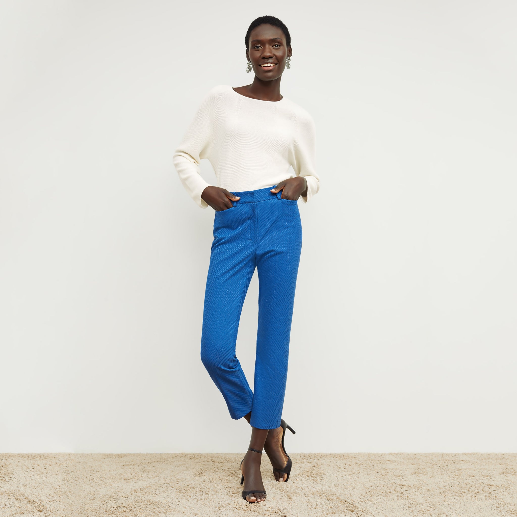 Front image of a woman standing wearing the condesa pant in basketweave jacquard in azure 